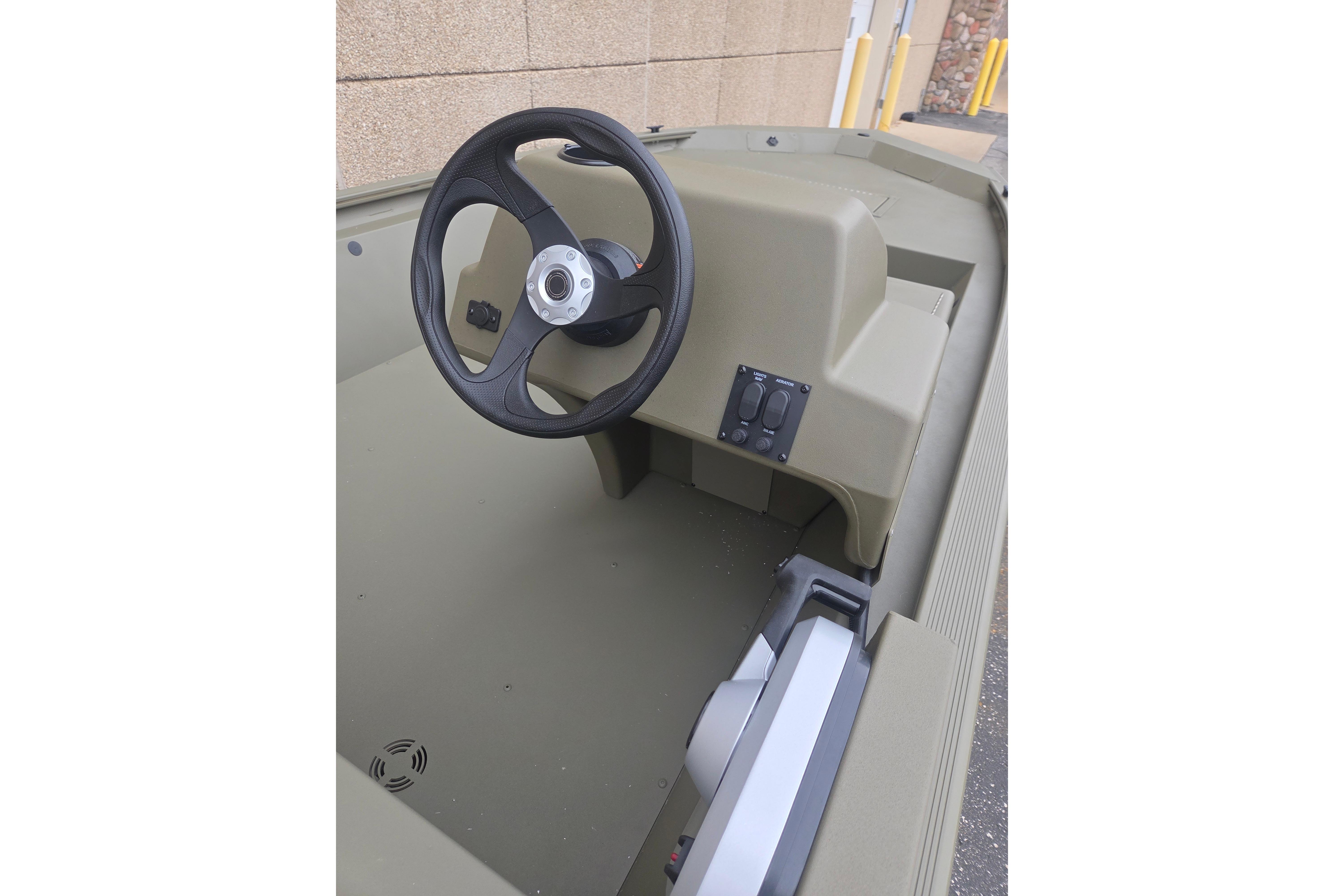 2026 Tracker Grizzly 1648 SC boat interior with steering wheel and control panel.