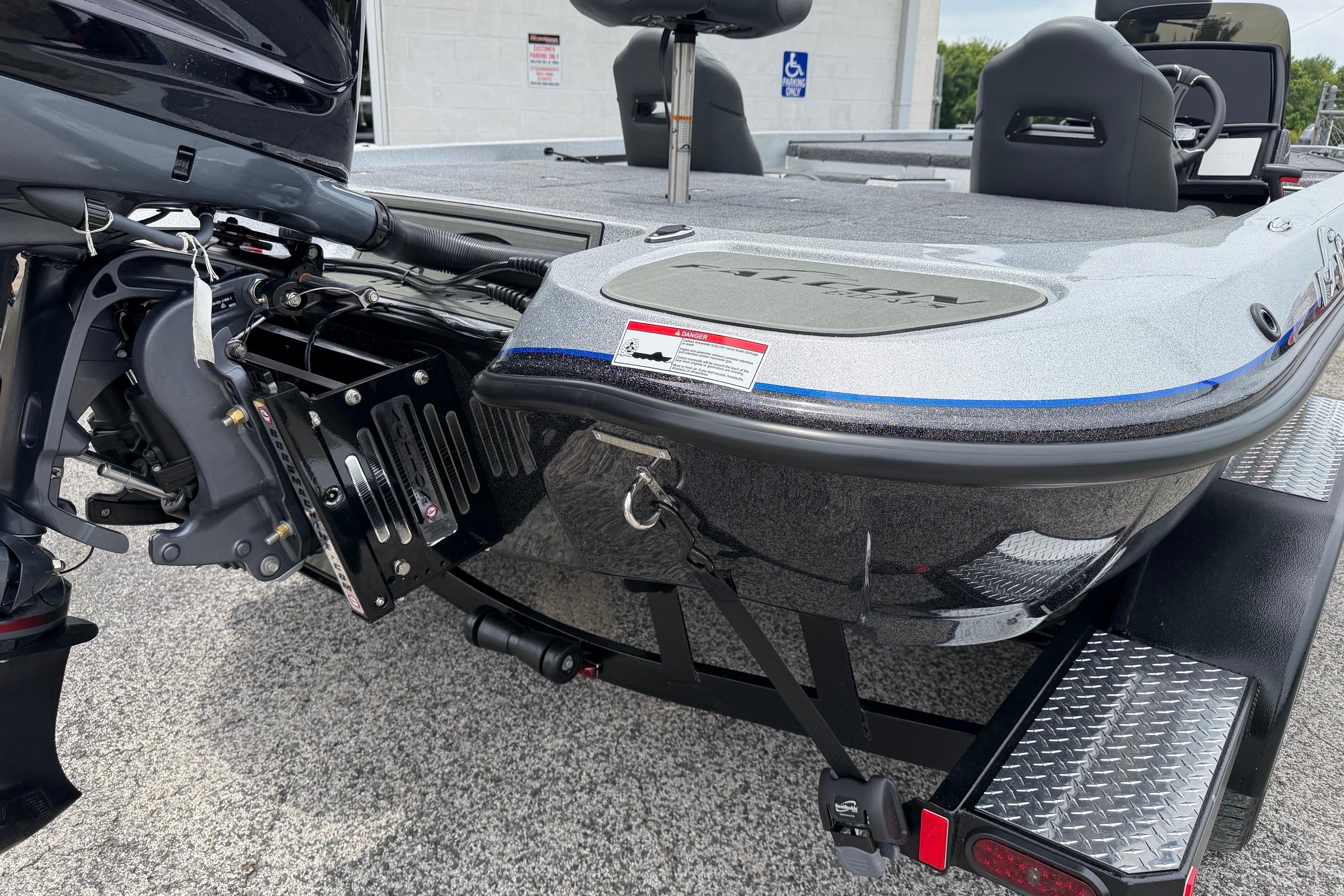 2027 Falcon F20 PREDATOR boat on trailer, featuring sleek design and powerful engine.