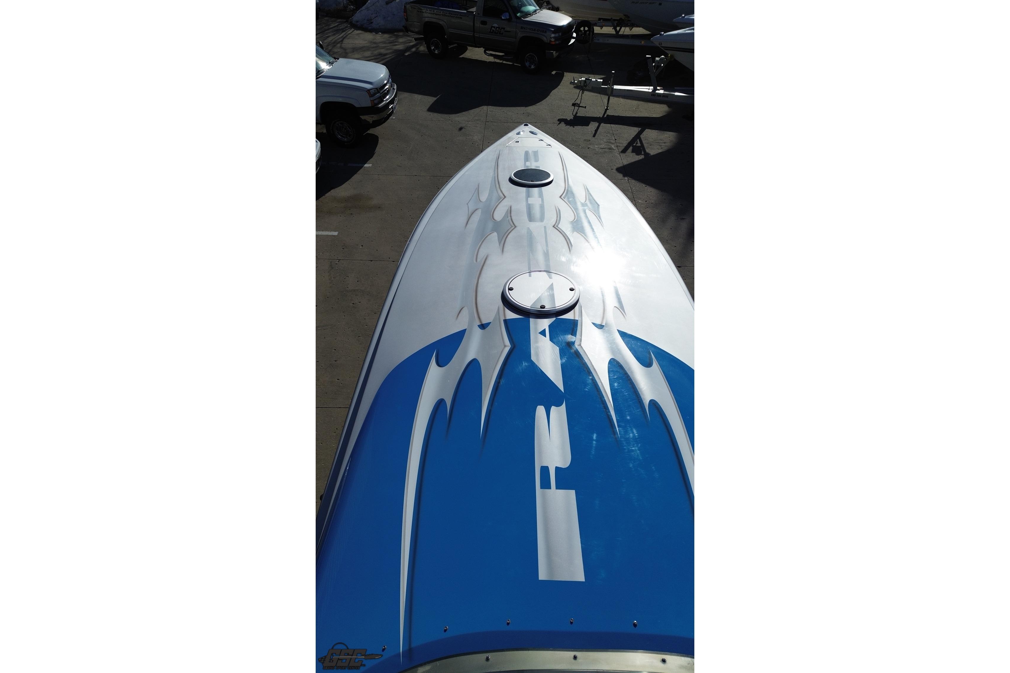Top view of 2007 Hustler 41 Razor boat with blue and white design.