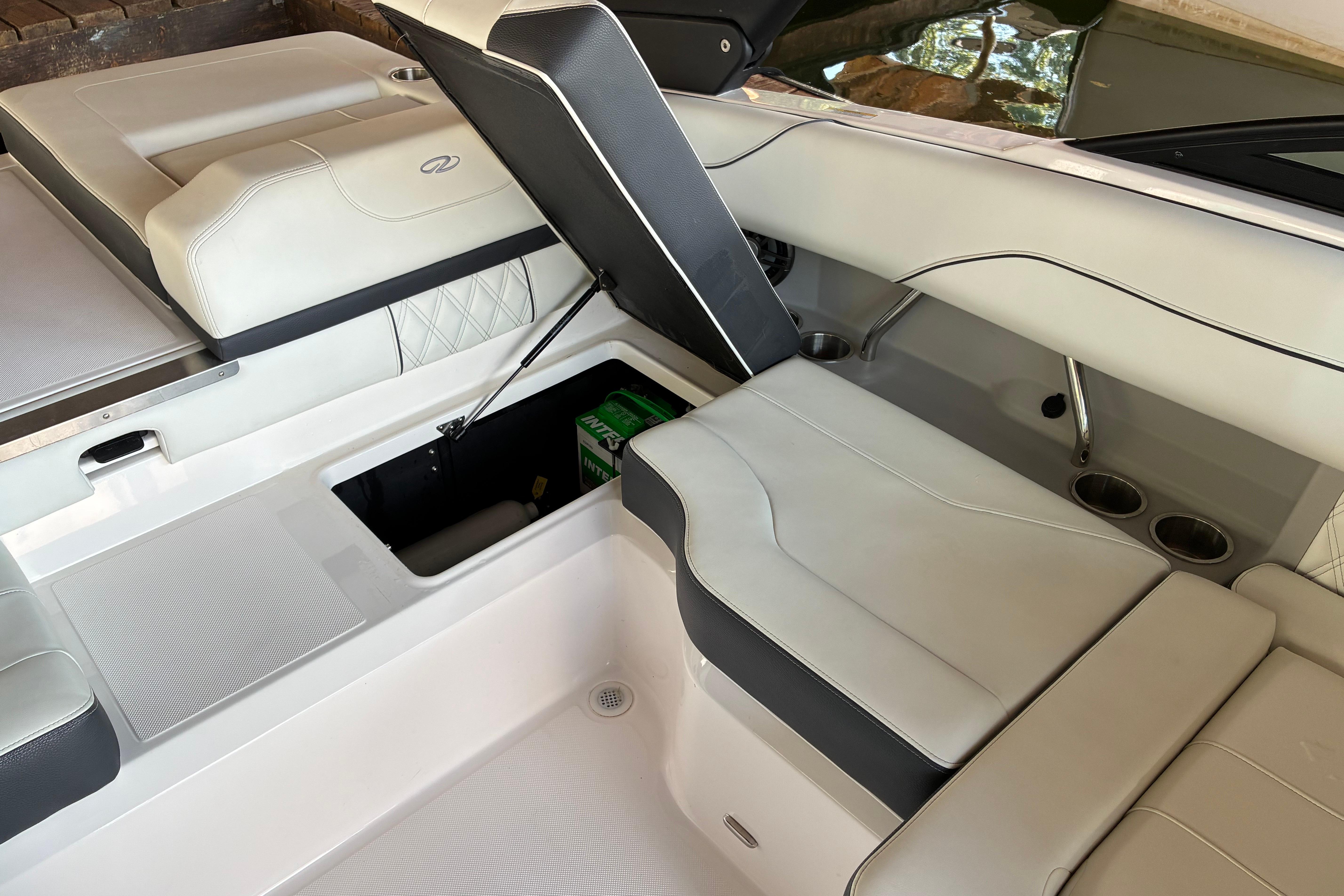 2025 Regal LS2 boat interior with open storage compartment and sleek seating design.