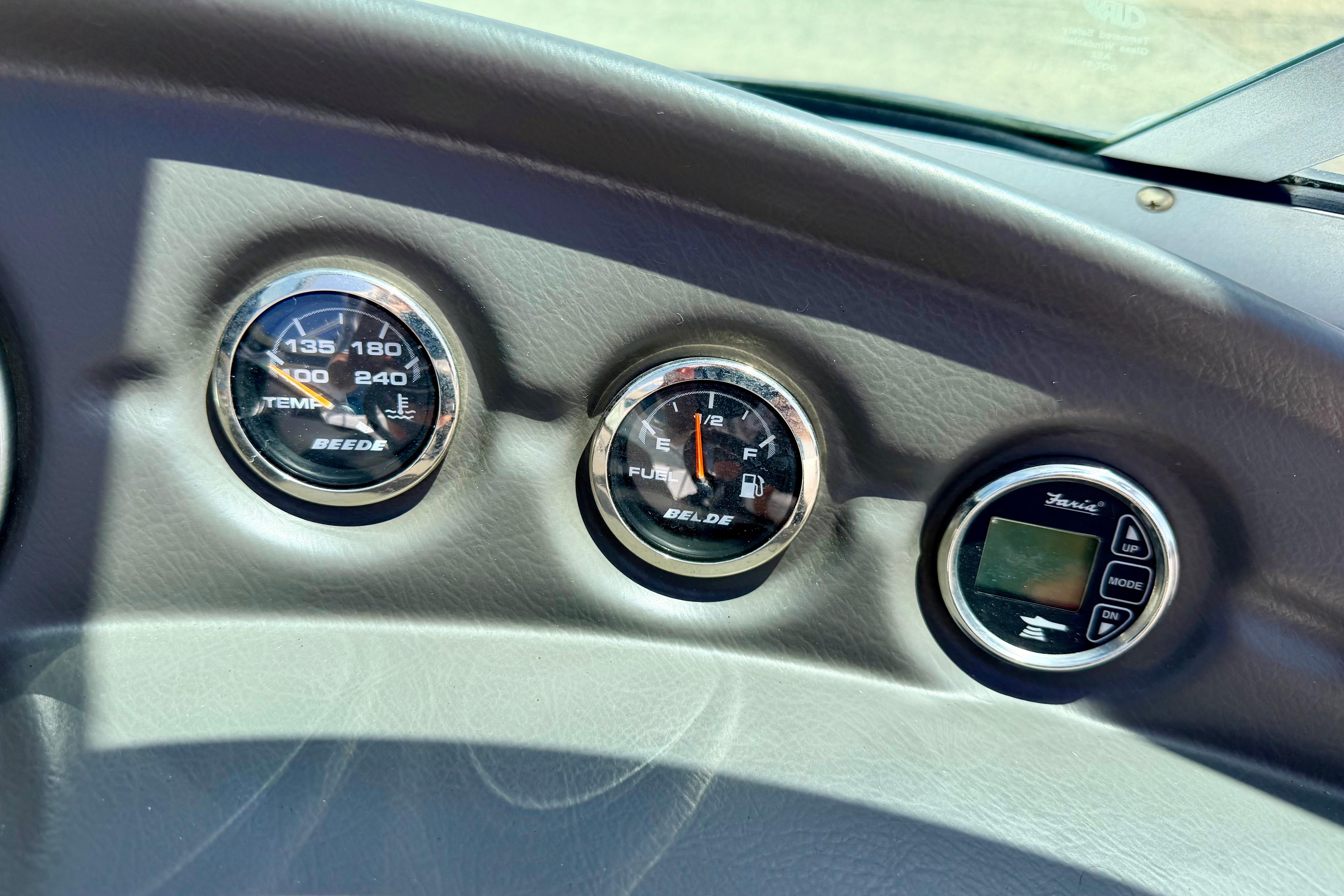 Dashboard gauges of a 2008 Moomba Outback V boat, showing temperature and fuel levels.