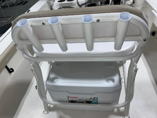 2026 Robalo 226 Cayman boat with rod holders and cooler storage.