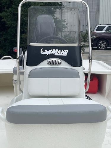 2025 Mako Pro Skiff 17 CC boat, front view, with steering console and seating.
