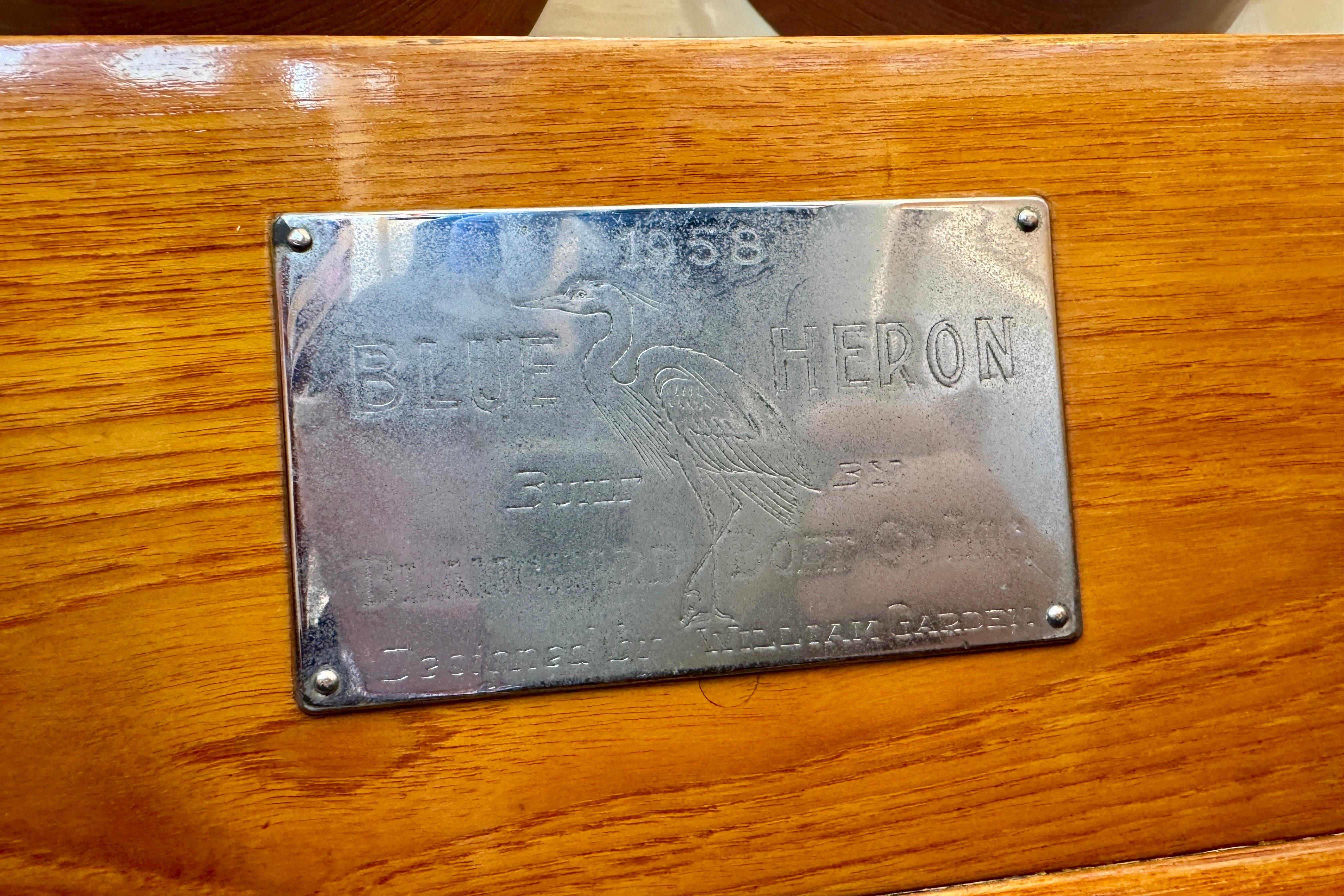 Plaque on 1958 Blanchard Pilothouse, engraved with "Blue Heron" and heron illustration.