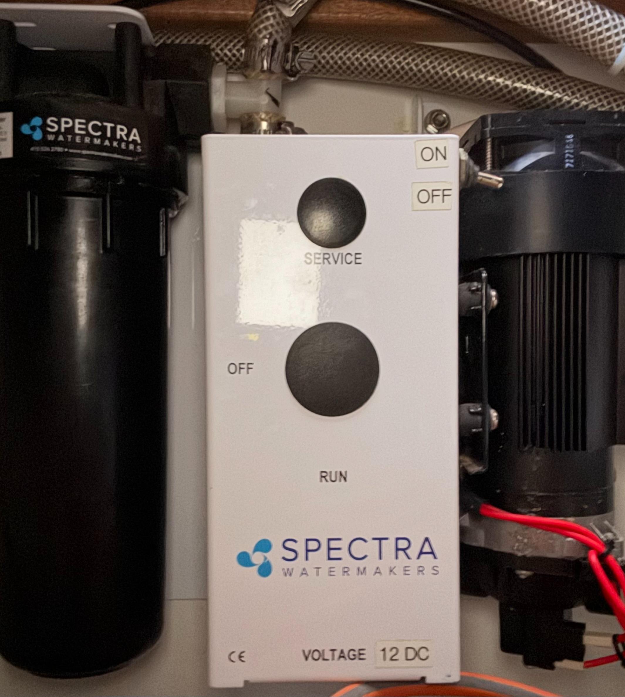 Spectra Watermakers control panel on Leopard 38, 2010 model, with service and run buttons.