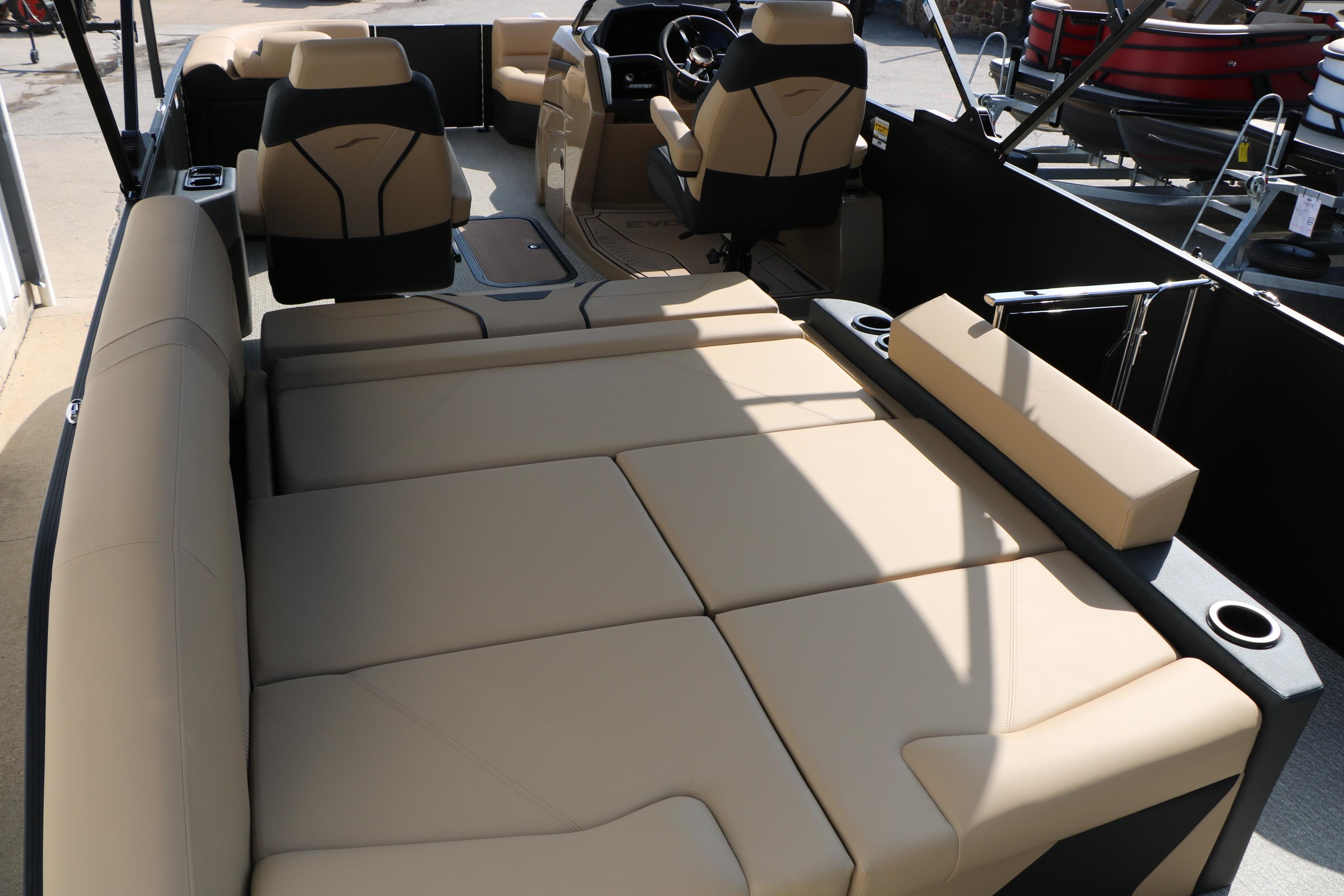 Luxurious interior of 2026 Evotti 723CS boat with beige seating and modern design.