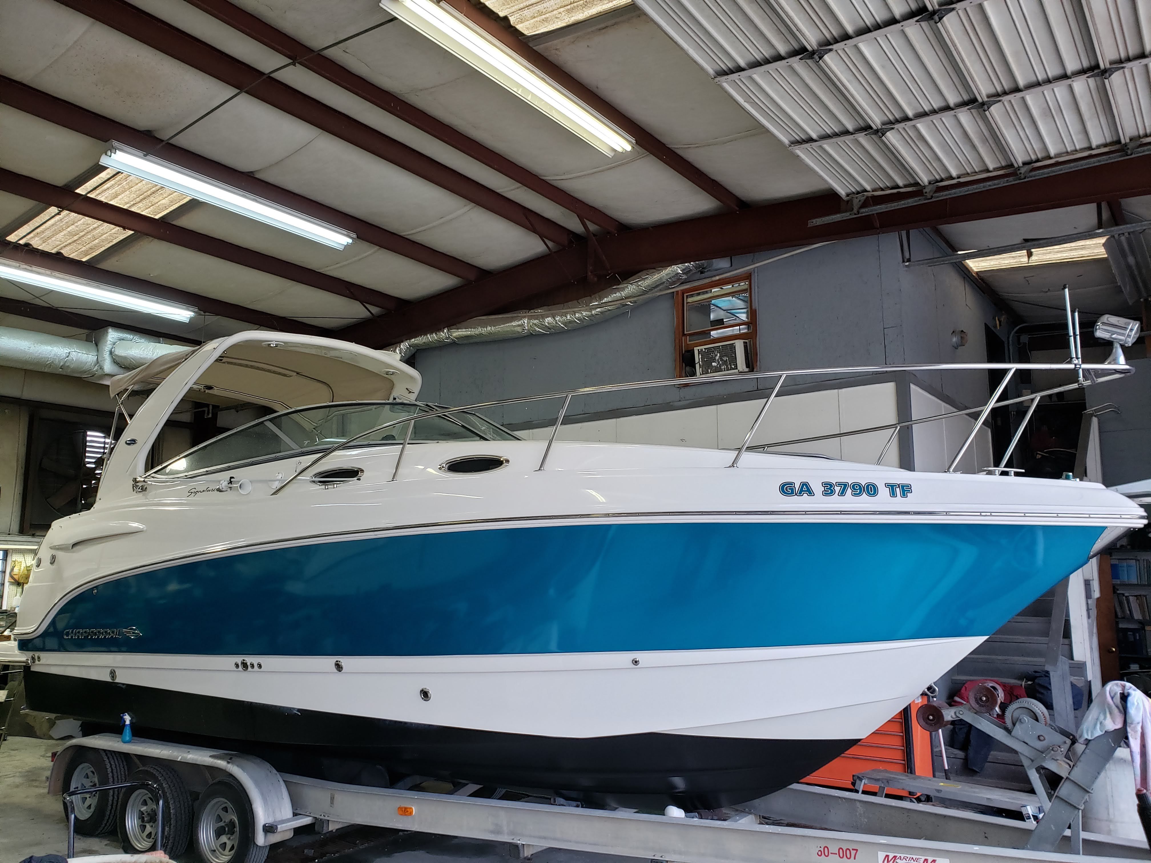 2006 Chaparral Signature 280 boat in a workshop.