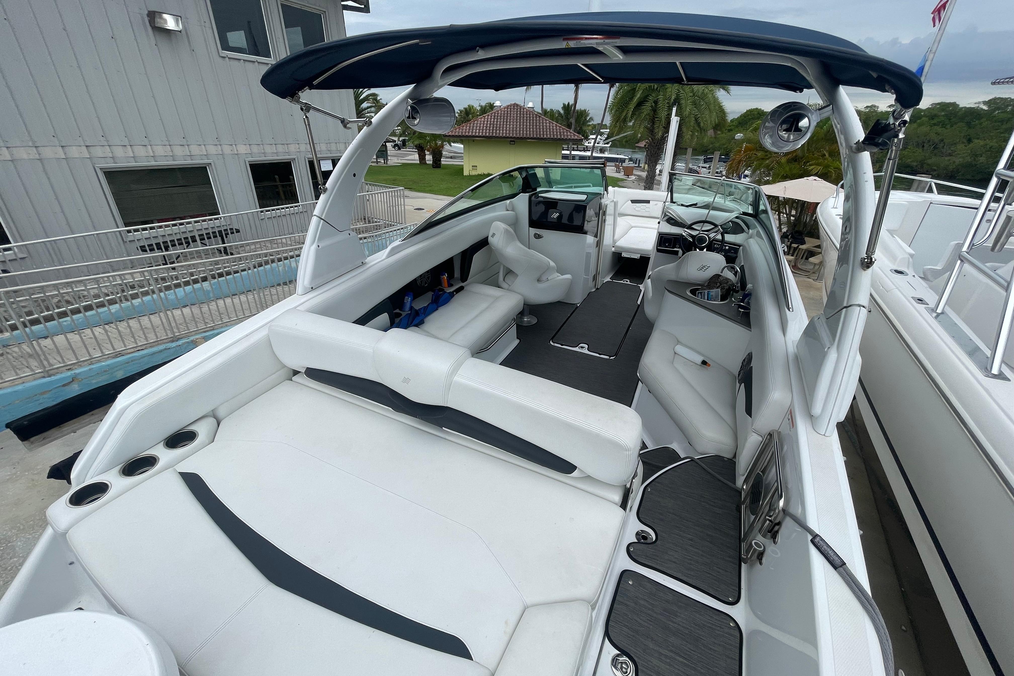 2022 Four Winns HD8 OB boat interior with white seating and modern design.