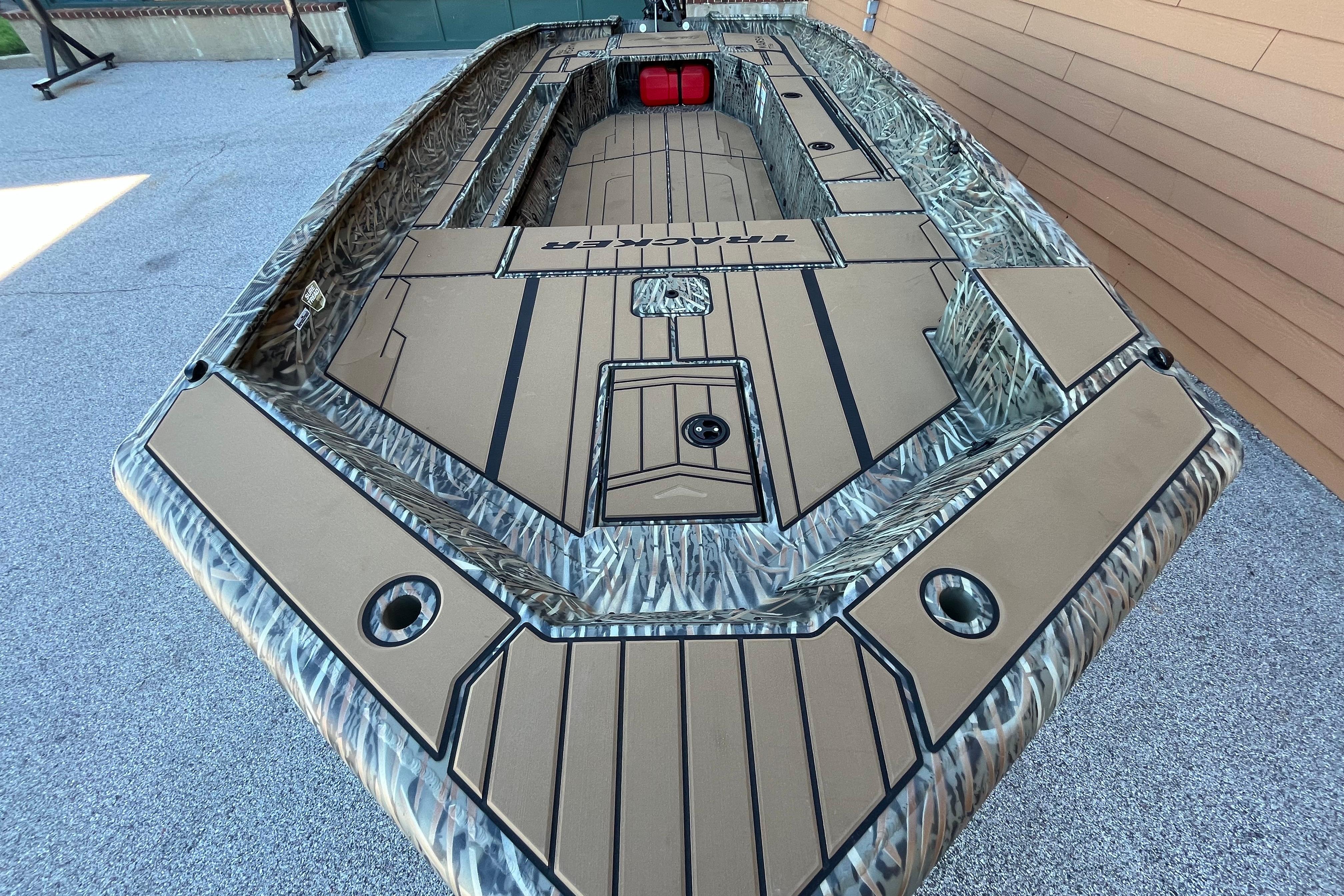 2026 Tracker Grizzly 1756 T Marsh boat with camo design and spacious deck layout.