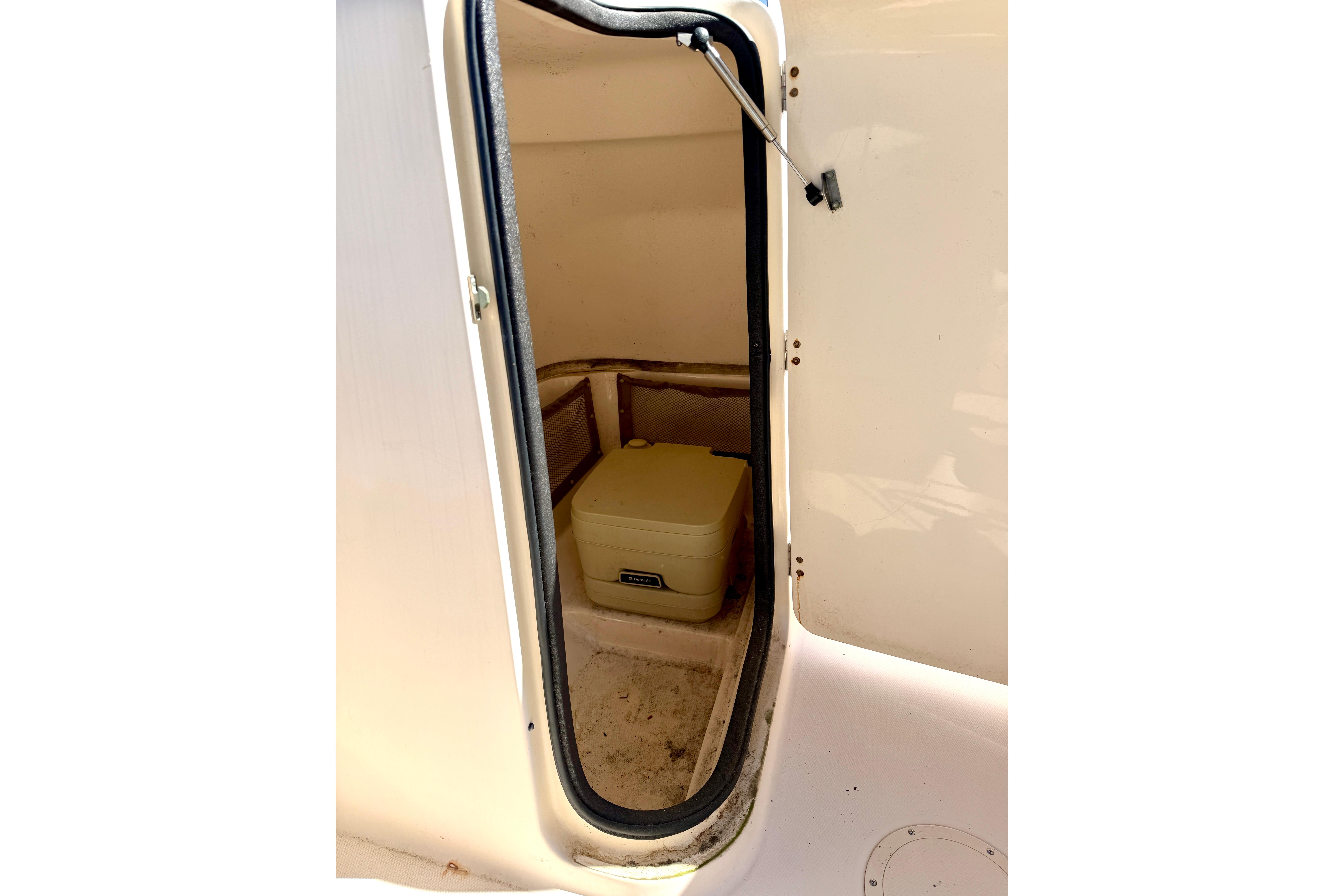 Interior storage compartment of 2005 Grady-White Freedom 225 boat.