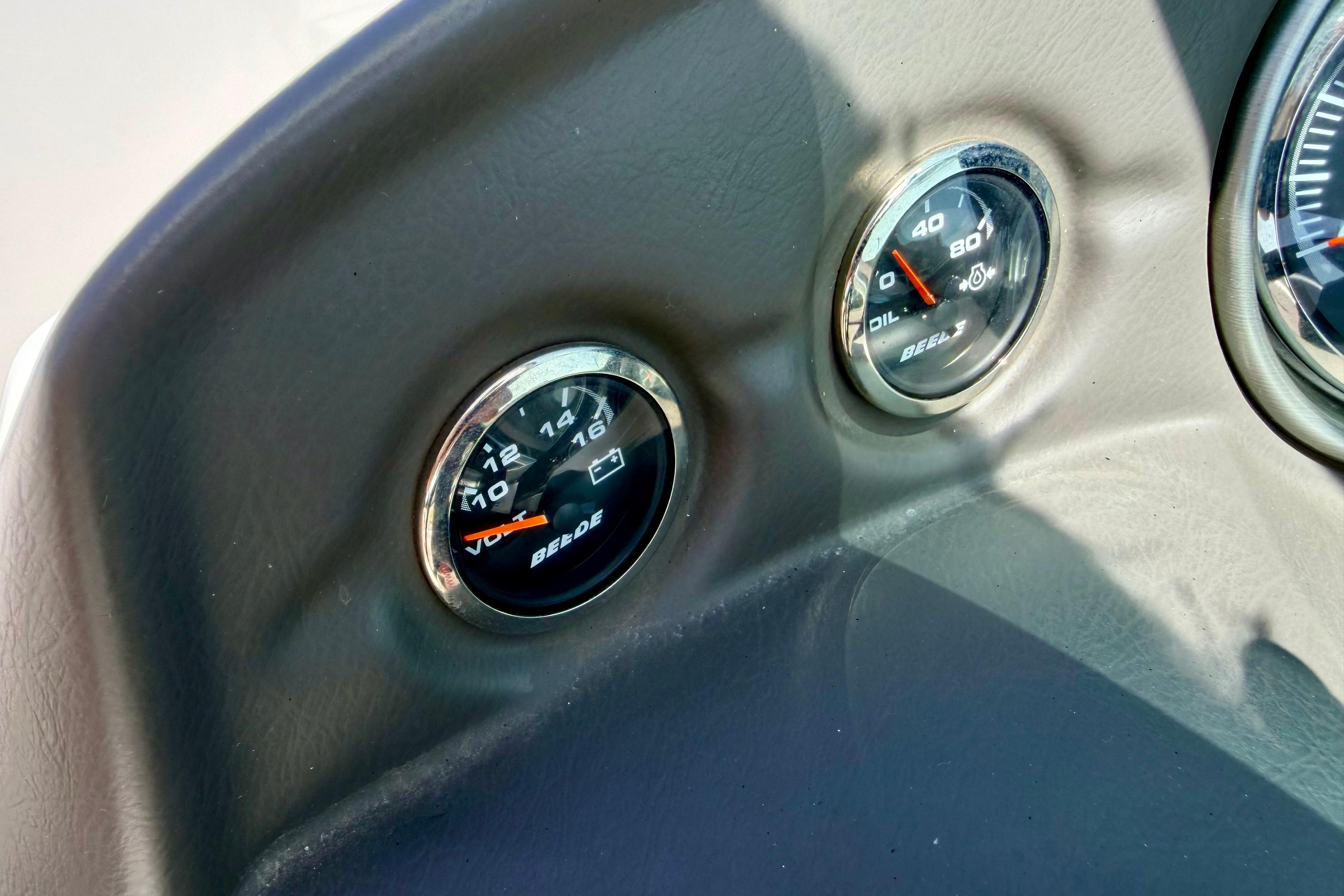 Dashboard gauges of a 2008 Moomba Outback V boat, showing voltage and oil pressure.