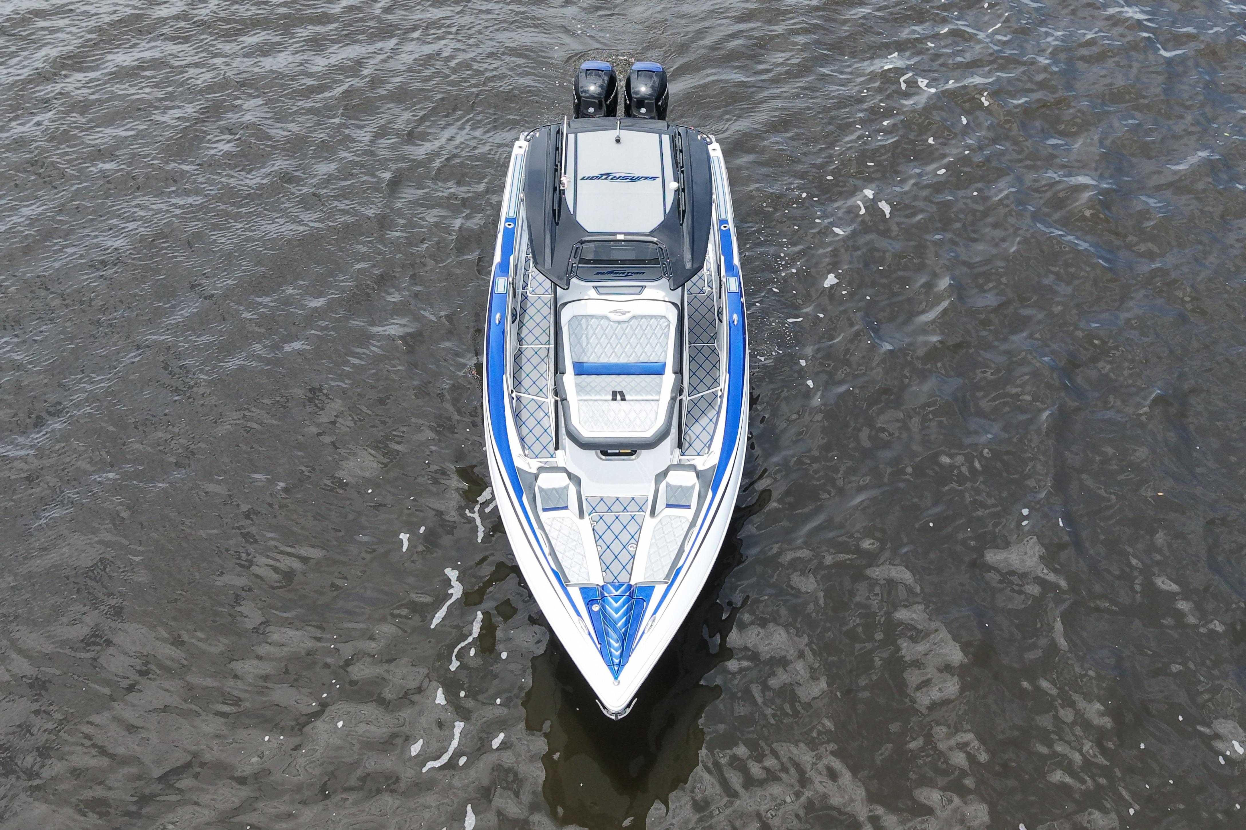 2020 Sunsation 32 CCX boat on water, aerial view, featuring sleek design and dual engines.