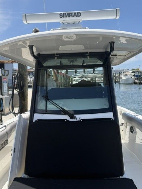 2023 Boston Whaler 330 Outrage boat with Simrad equipment at the dock.