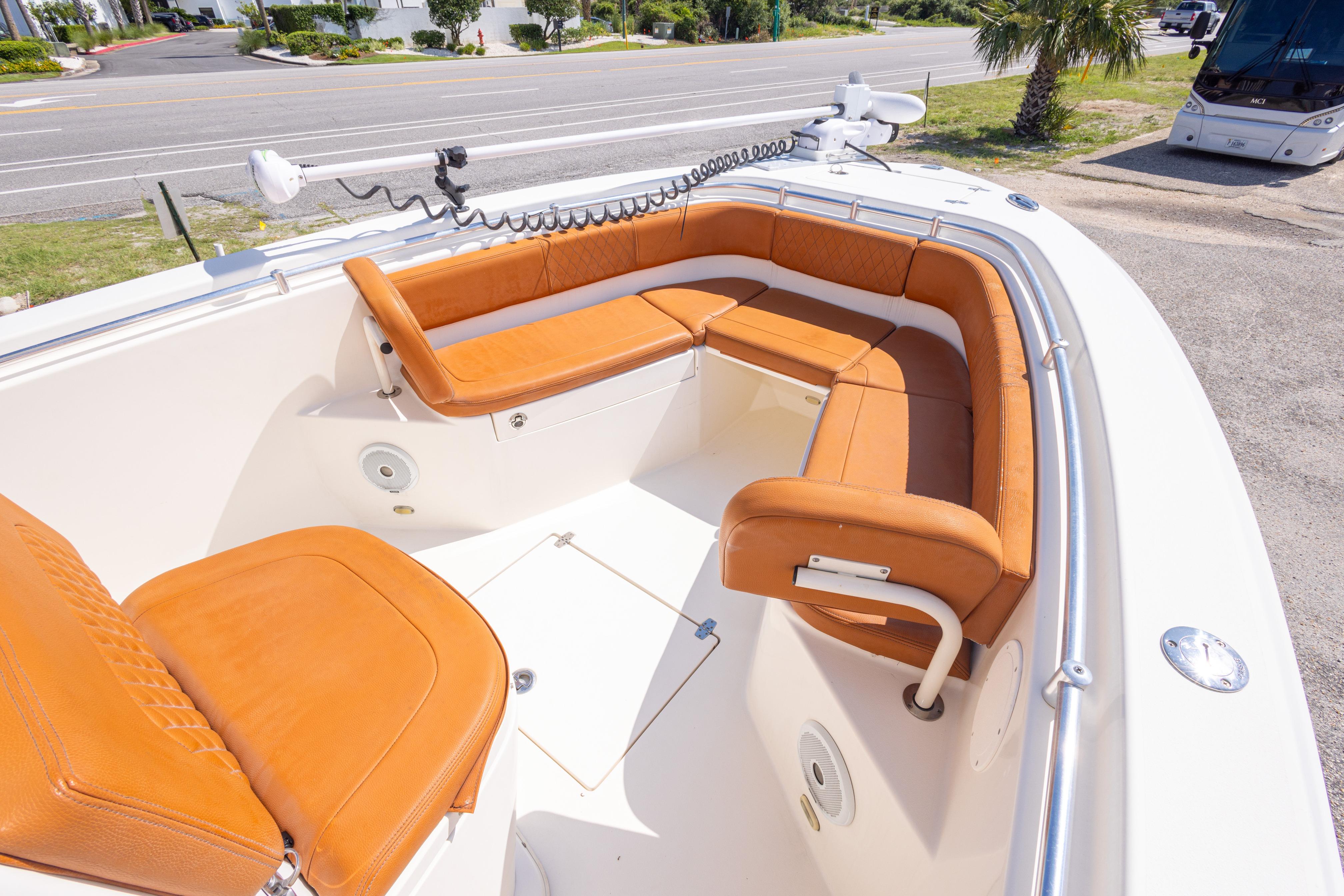 2017 Cobia 261 Center Console boat with tan seating and spacious deck layout.