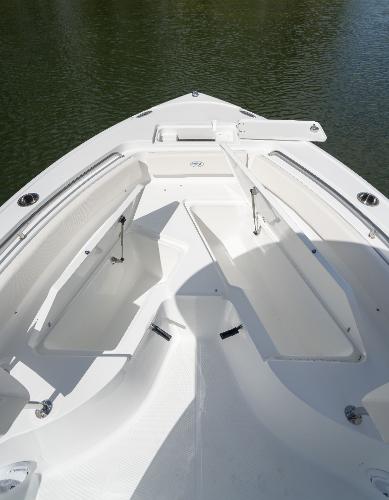 2024 Sea Hunt Ultra 234 boat bow seating area on calm water.