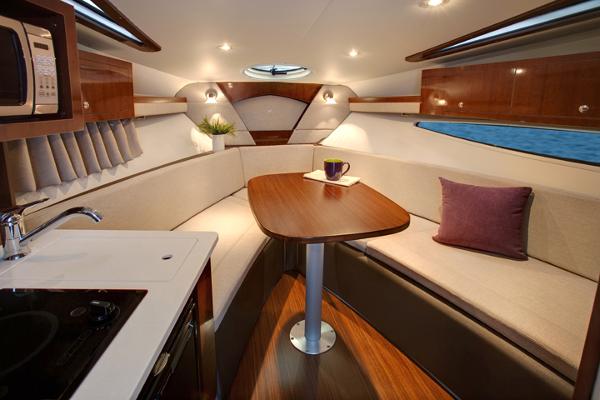 Manufacturer Provided Image: 2017 Four Winns Vista 275 cabin interior with dining area and kitchenette.