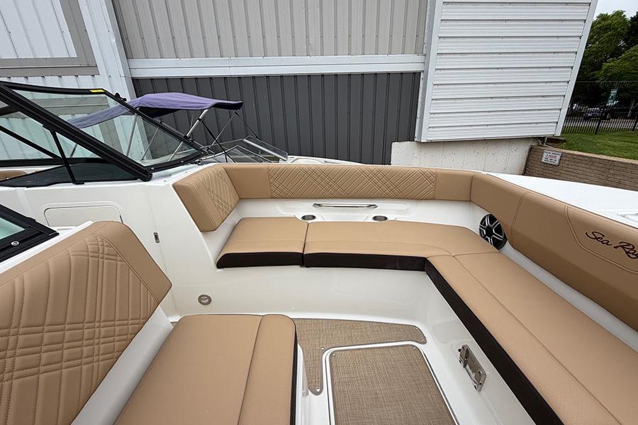 2026 Sea Ray SDX 270 Outboard boat interior with tan seating and modern design.