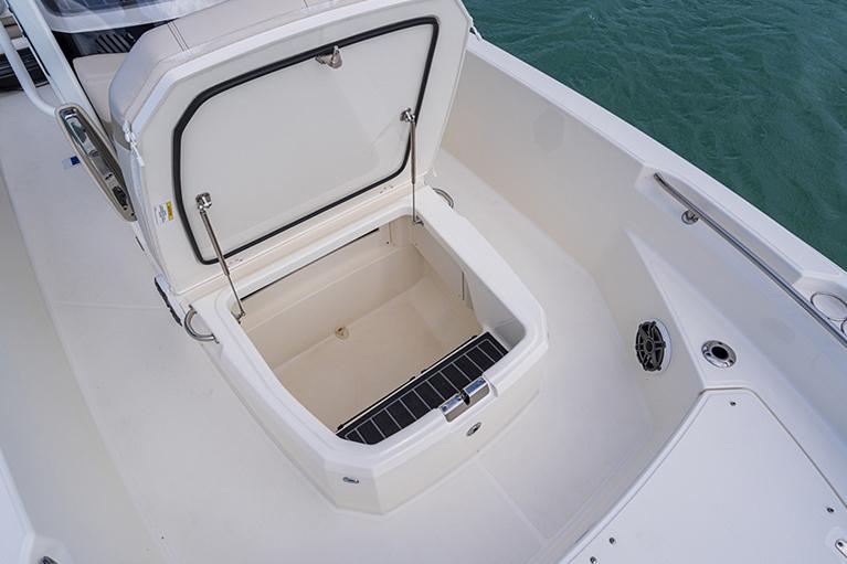 Manufacturer Provided Image: 2026 Boston Whaler 220 Dauntless boat storage compartment open on deck.
