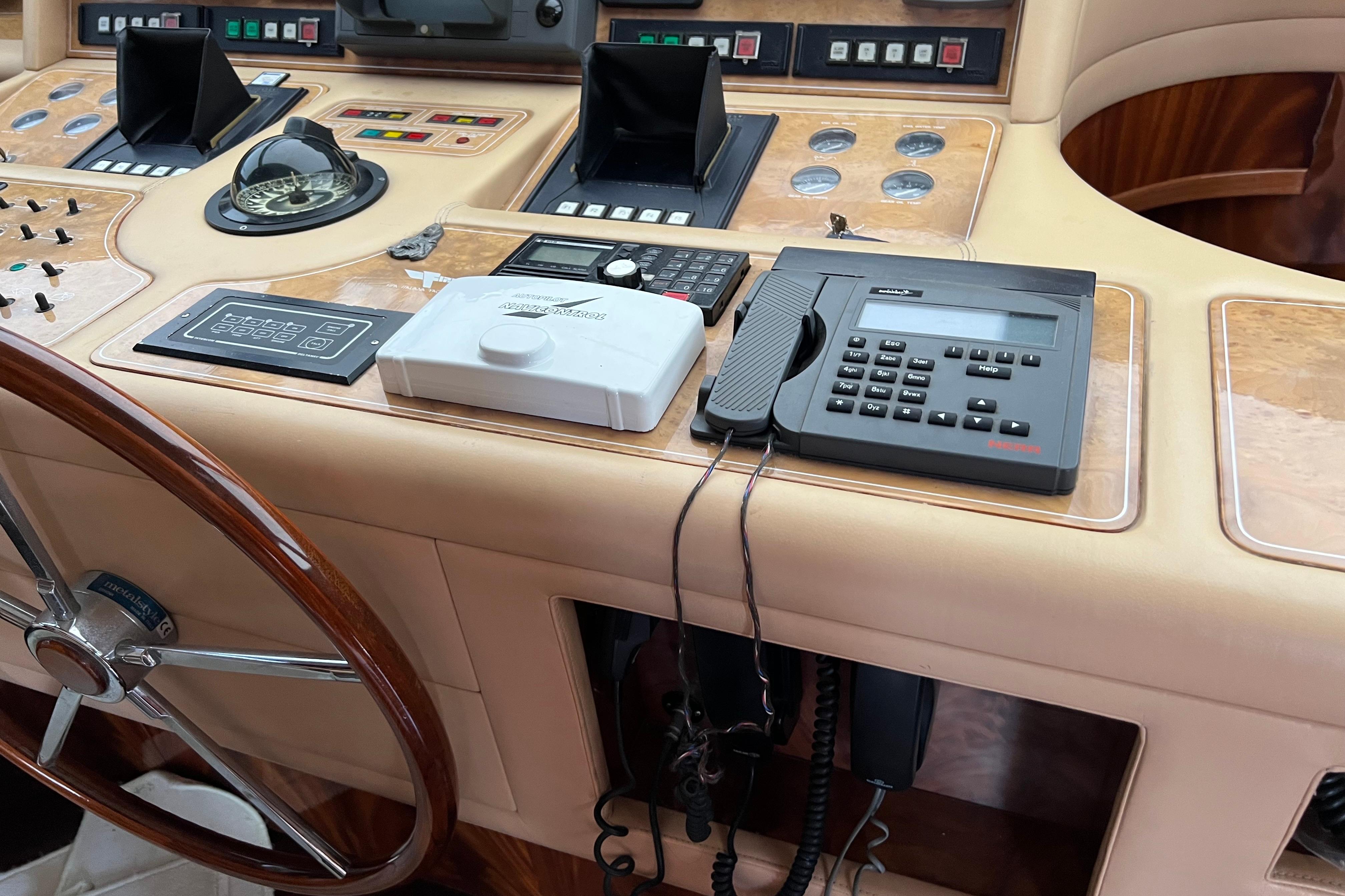 Control panel of a 2001 Maiora 24 yacht with navigation instruments and communication devices.