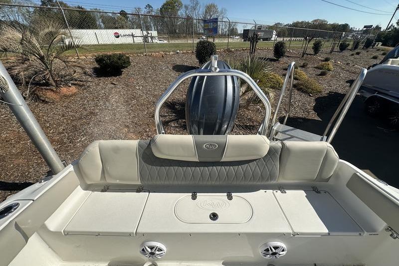 2026 Key West 219 FS boat interior with seating and engine view.