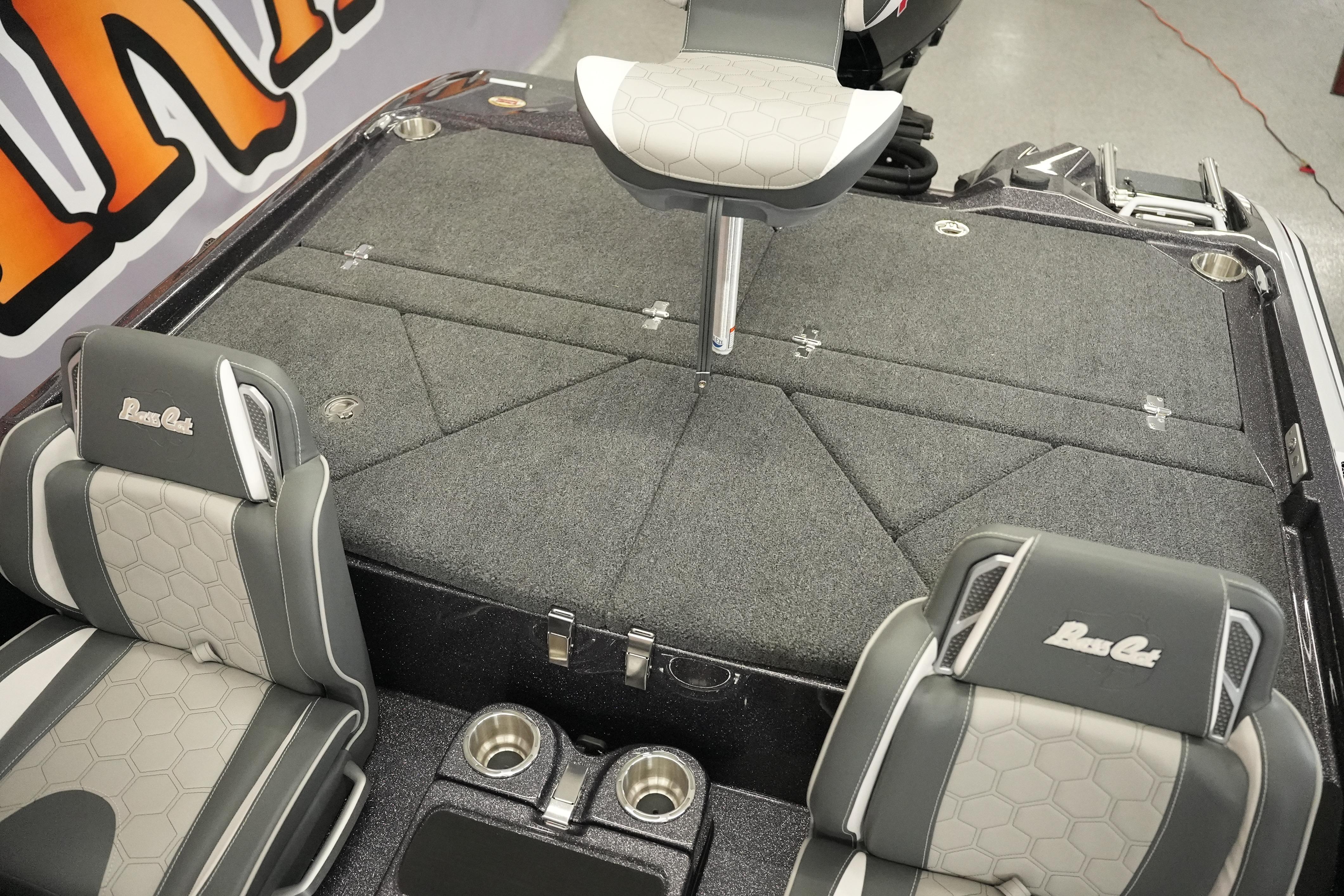2026 Bass Cat Puma STS boat interior with gray seating and carpeted deck.