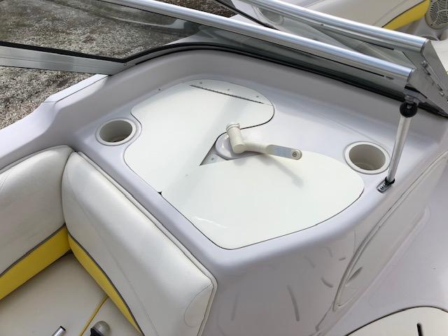 2005 Tahoe Q4 I/O boat interior with white and yellow seating.