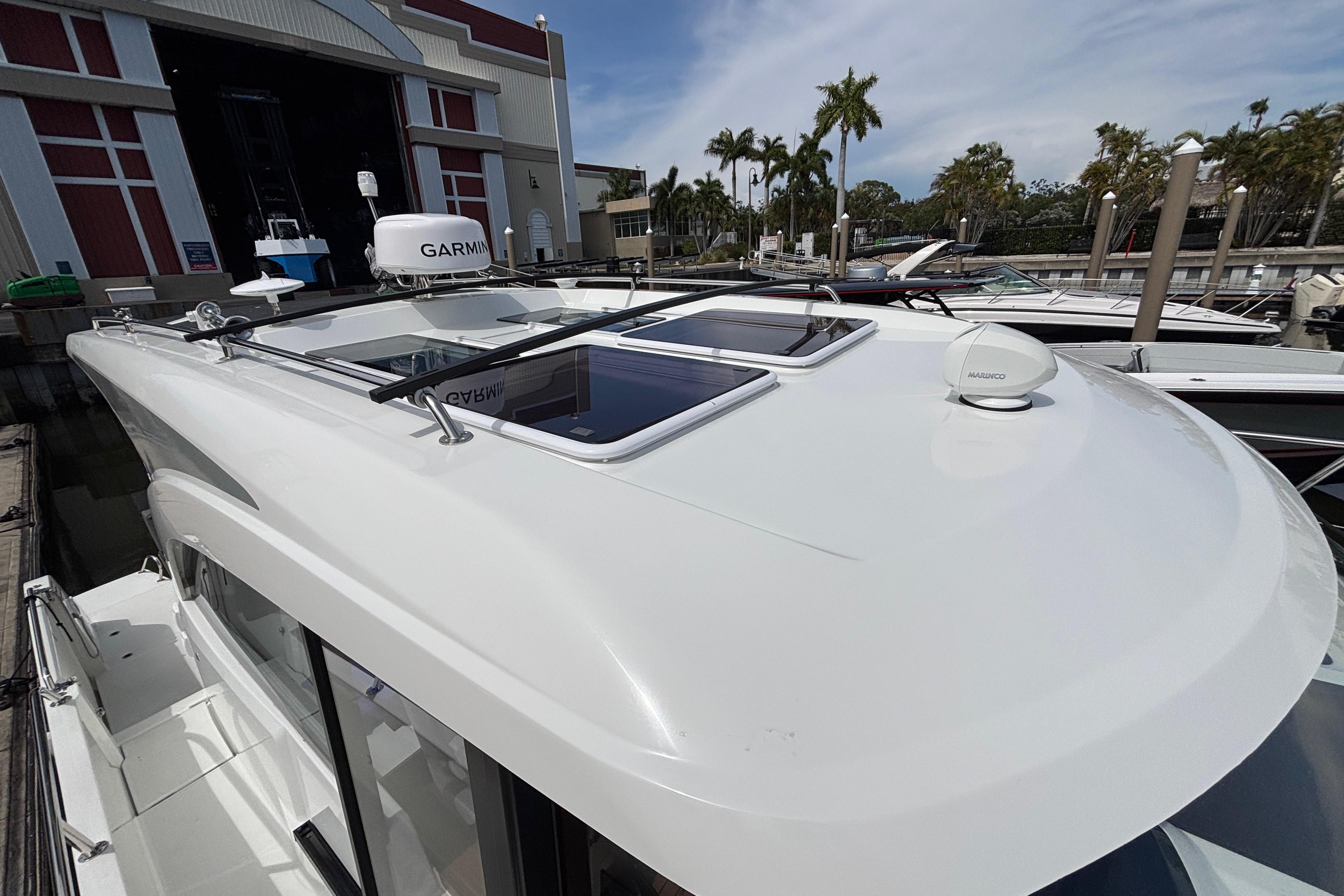 2024 Beneteau Antares 11 boat docked, featuring sleek design and advanced navigation equipment.