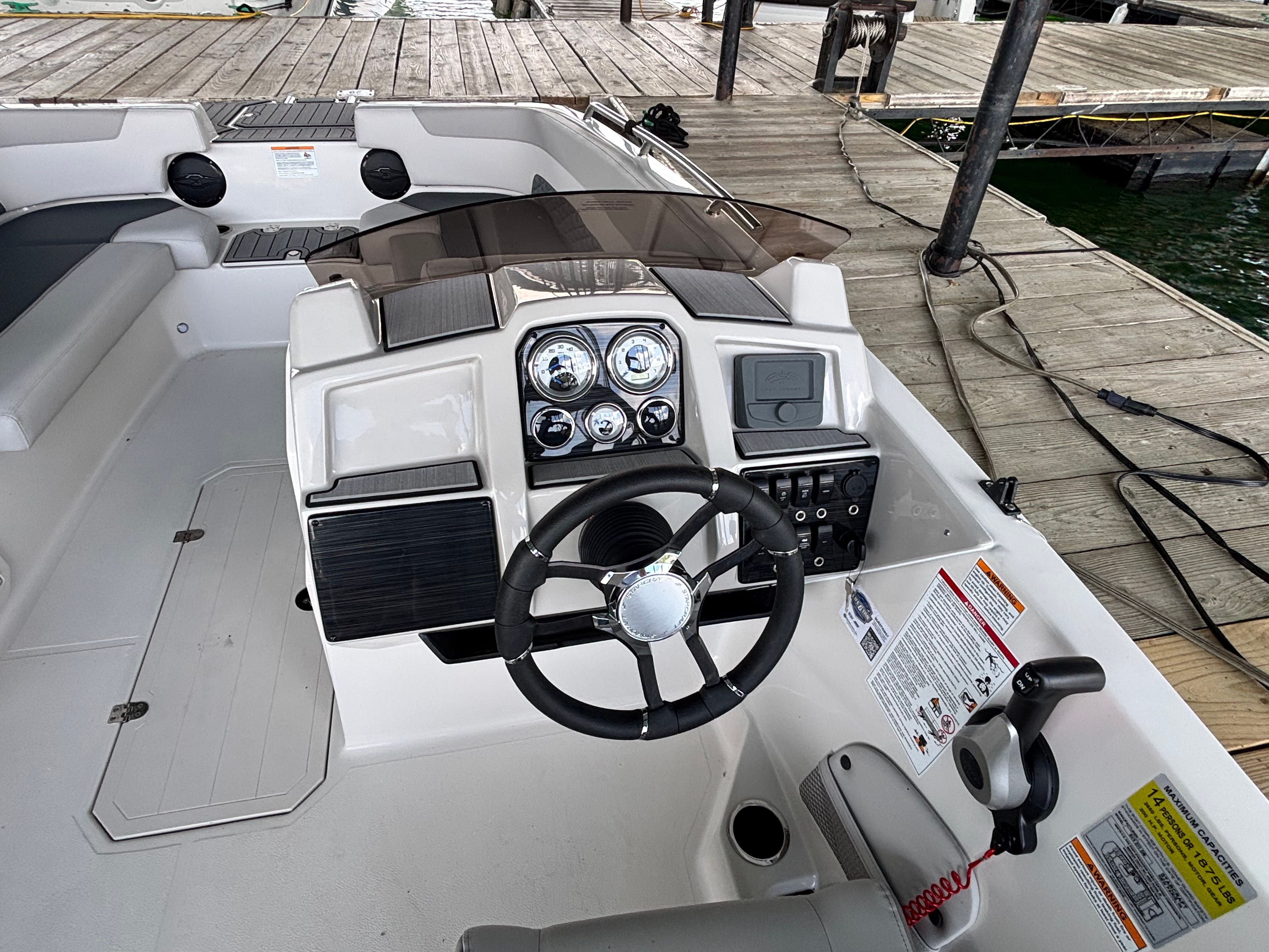 The cockpit of a 2027 Starcraft 211SVXOB with modern steering and instruments.