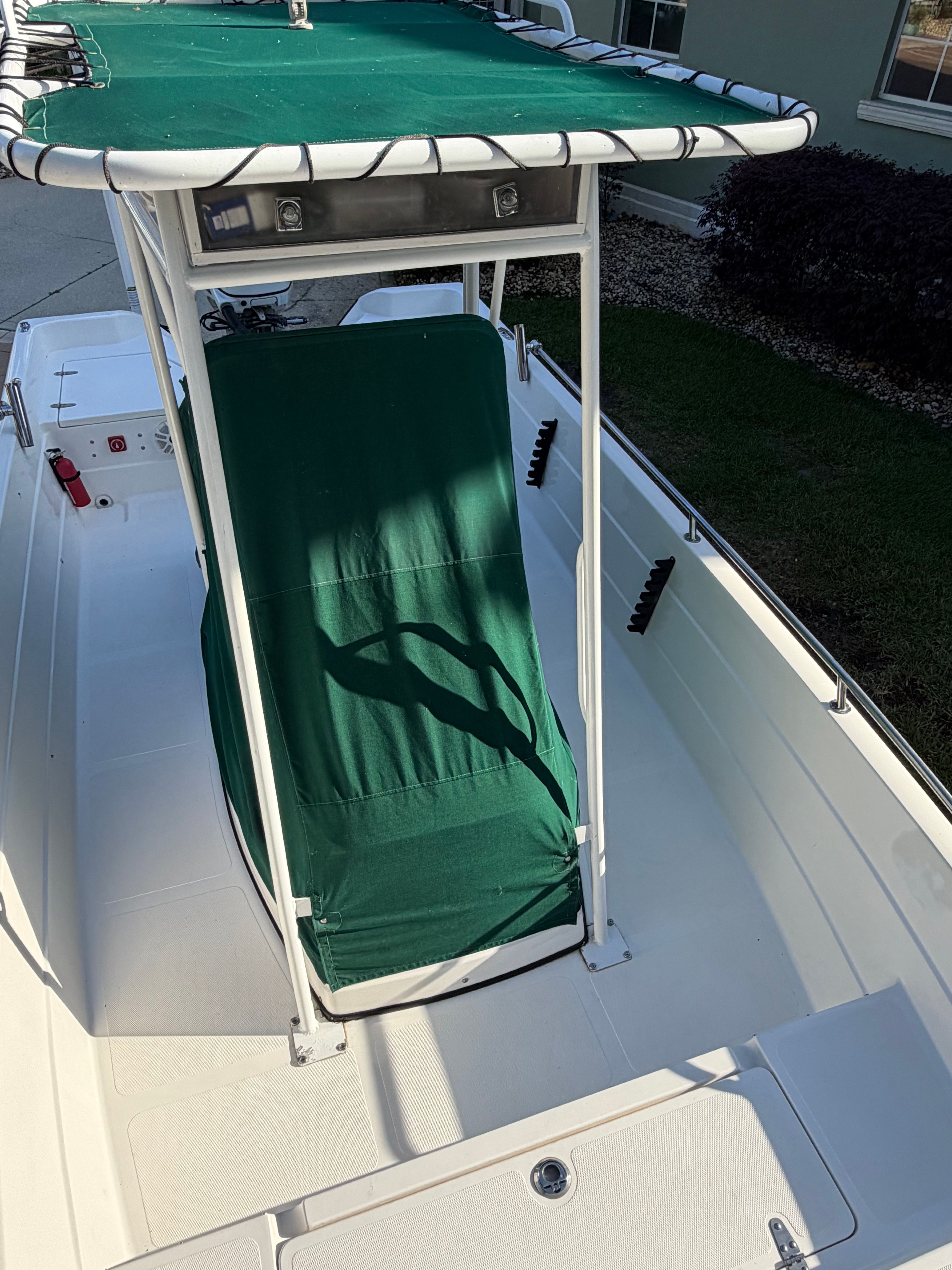 1999 Skeeter ZX2200 boat with green seat cover and sunshade.