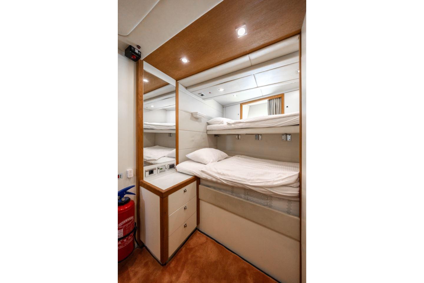 Interior of 2009 Sunseeker 34 Metre Yacht with bunk beds and storage.