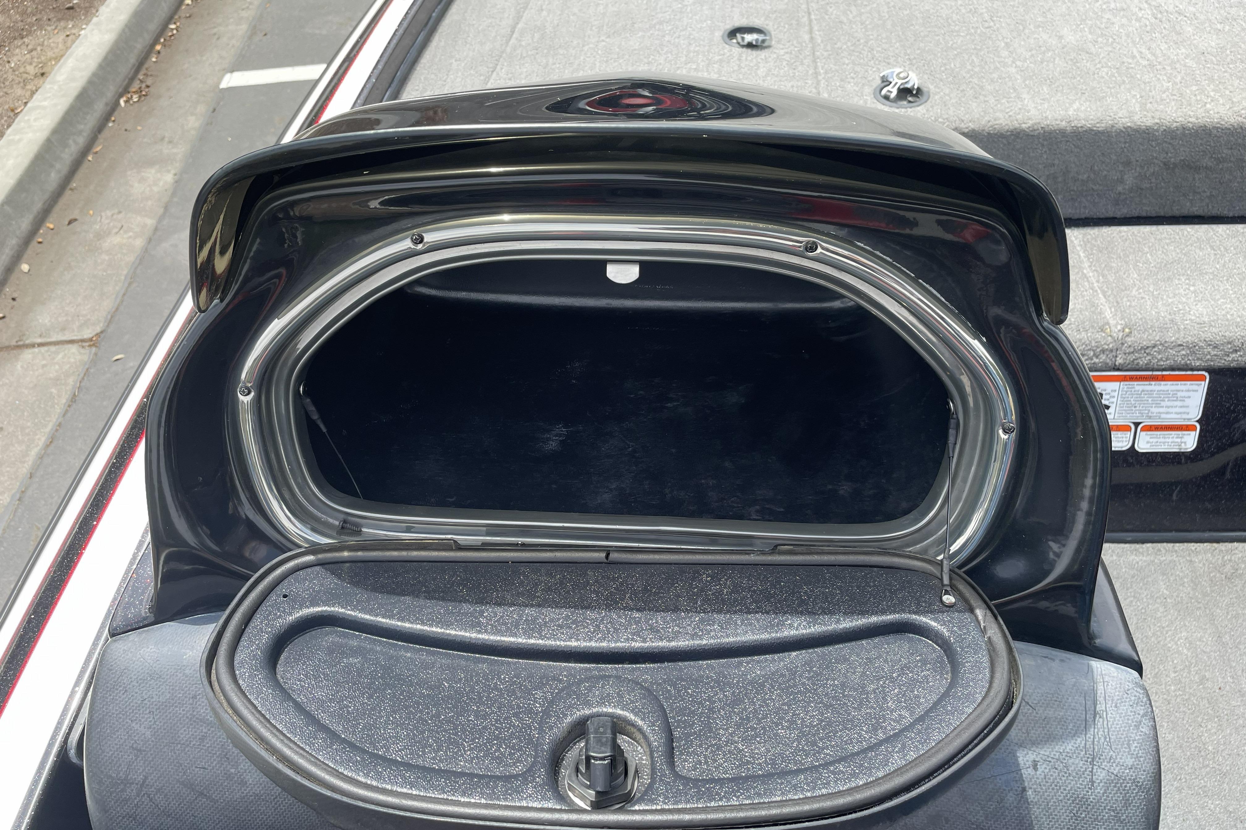 Open storage compartment of a 2013 Nitro Z-8 boat, showing interior space.