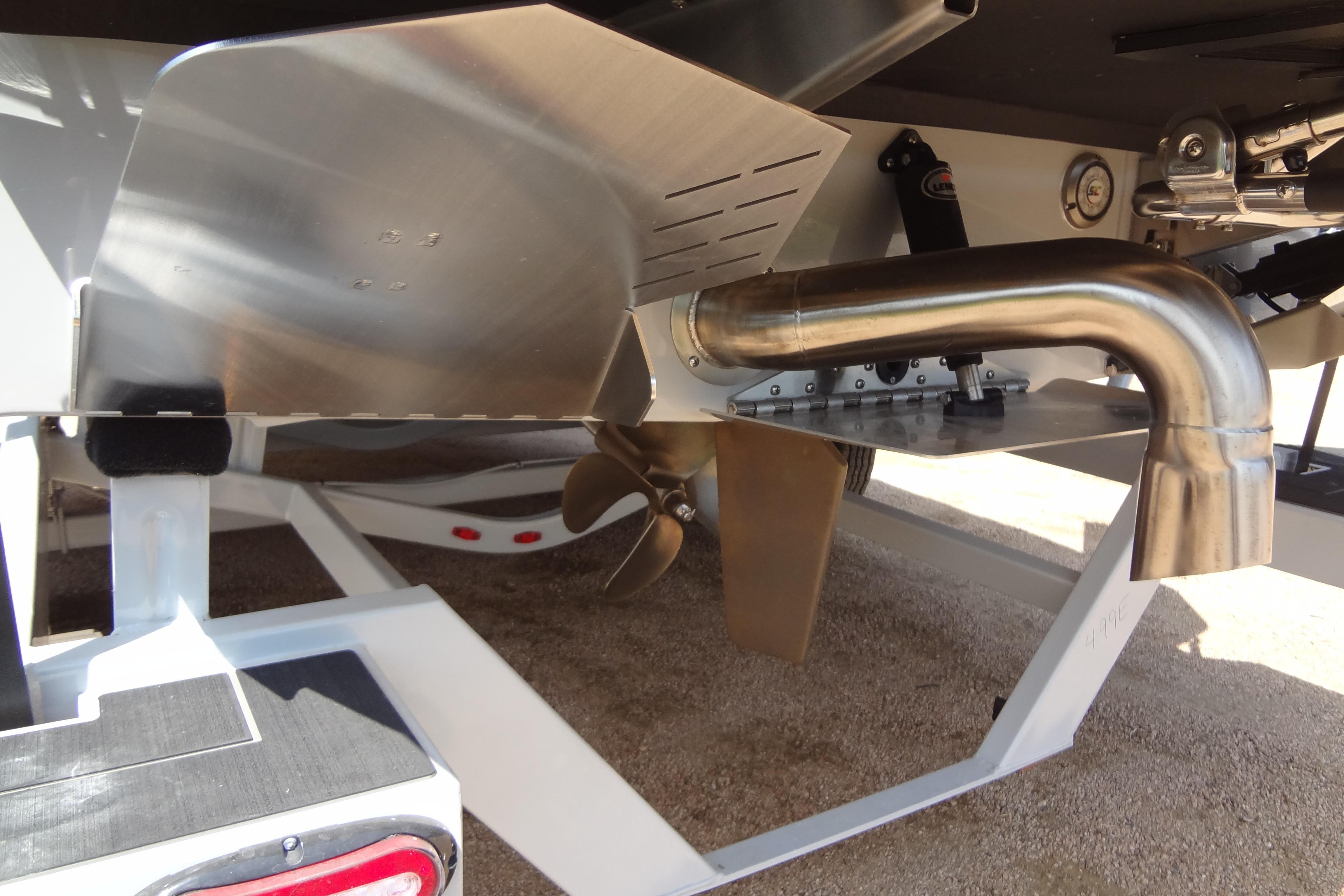 2022 ATX Surf Boats 24 Type-S propeller and exhaust system close-up.