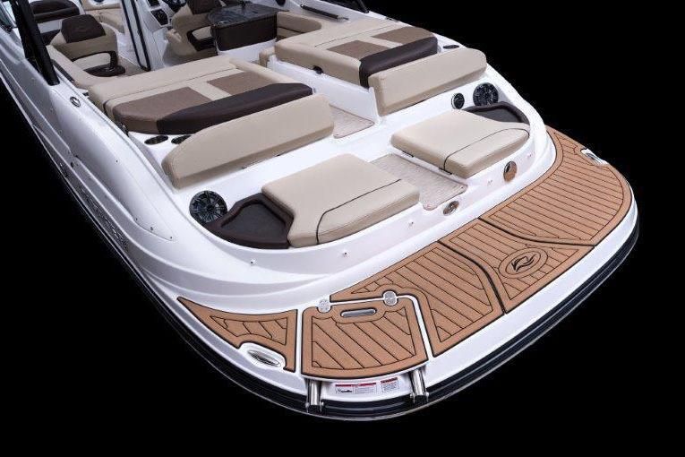 2017 Rinker QX29 BR boat with luxurious deck and seating area.