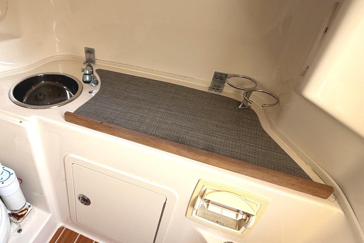2018 Grady-White Canyon 306 boat interior with sink and storage area.
