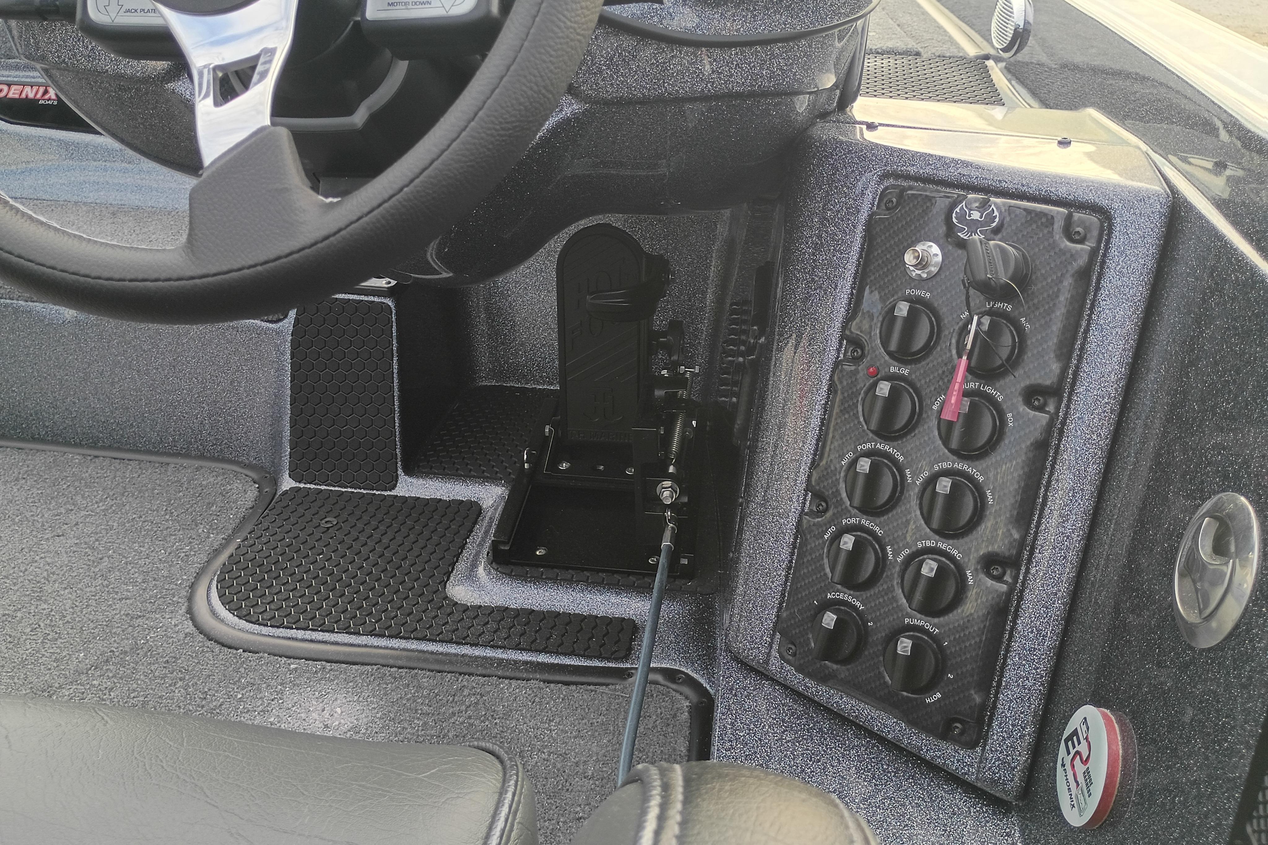 Phoenix 921 ELITEX 2026 dashboard with steering wheel and control panel.