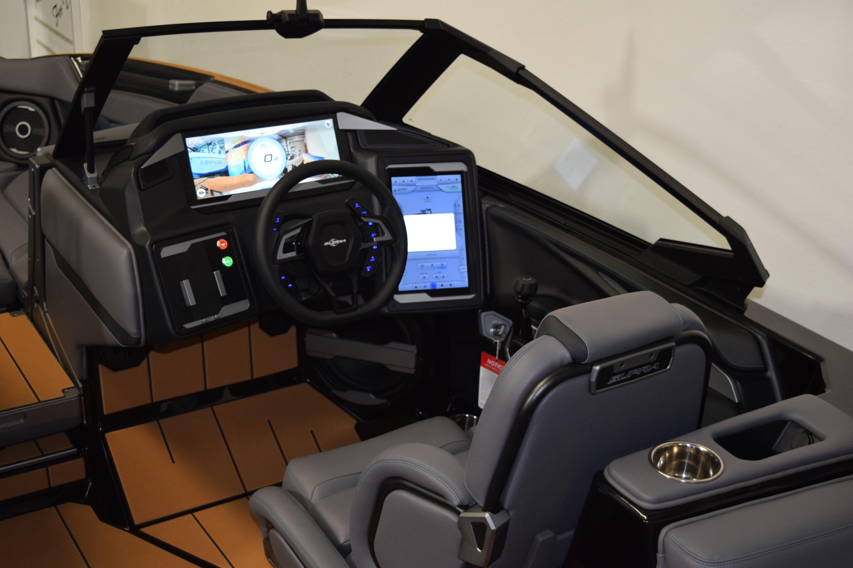 2026 Supra SL 550 boat interior with advanced dashboard and steering controls.