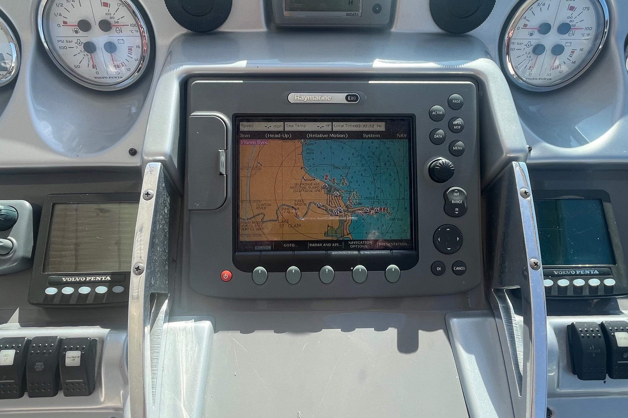 Dashboard of a 2010 Monterey 400 Sport Yacht with navigation system and gauges.
