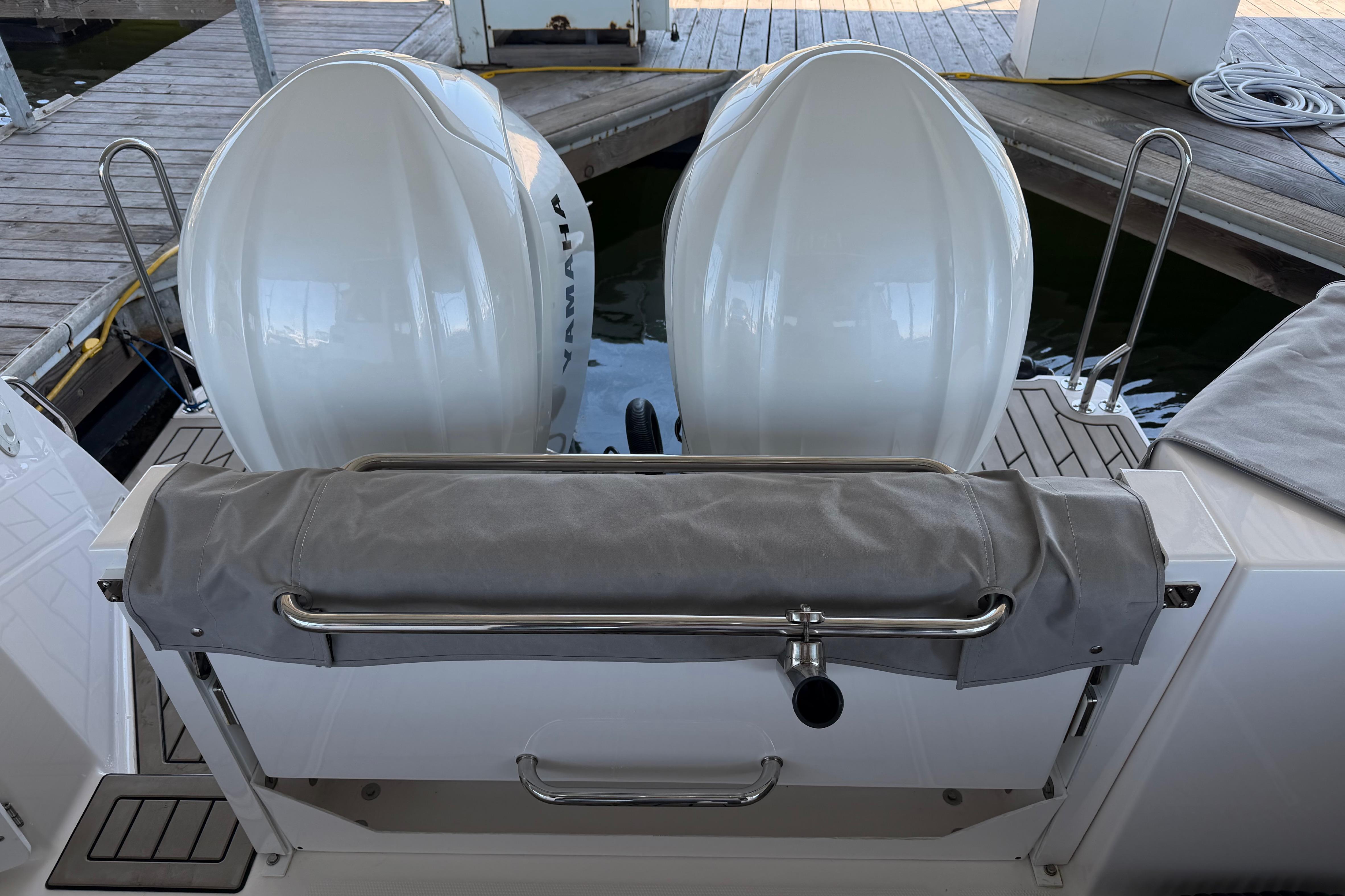 2023 Cutwater C-288 Coupe boat with dual Yamaha outboard engines at dock.
