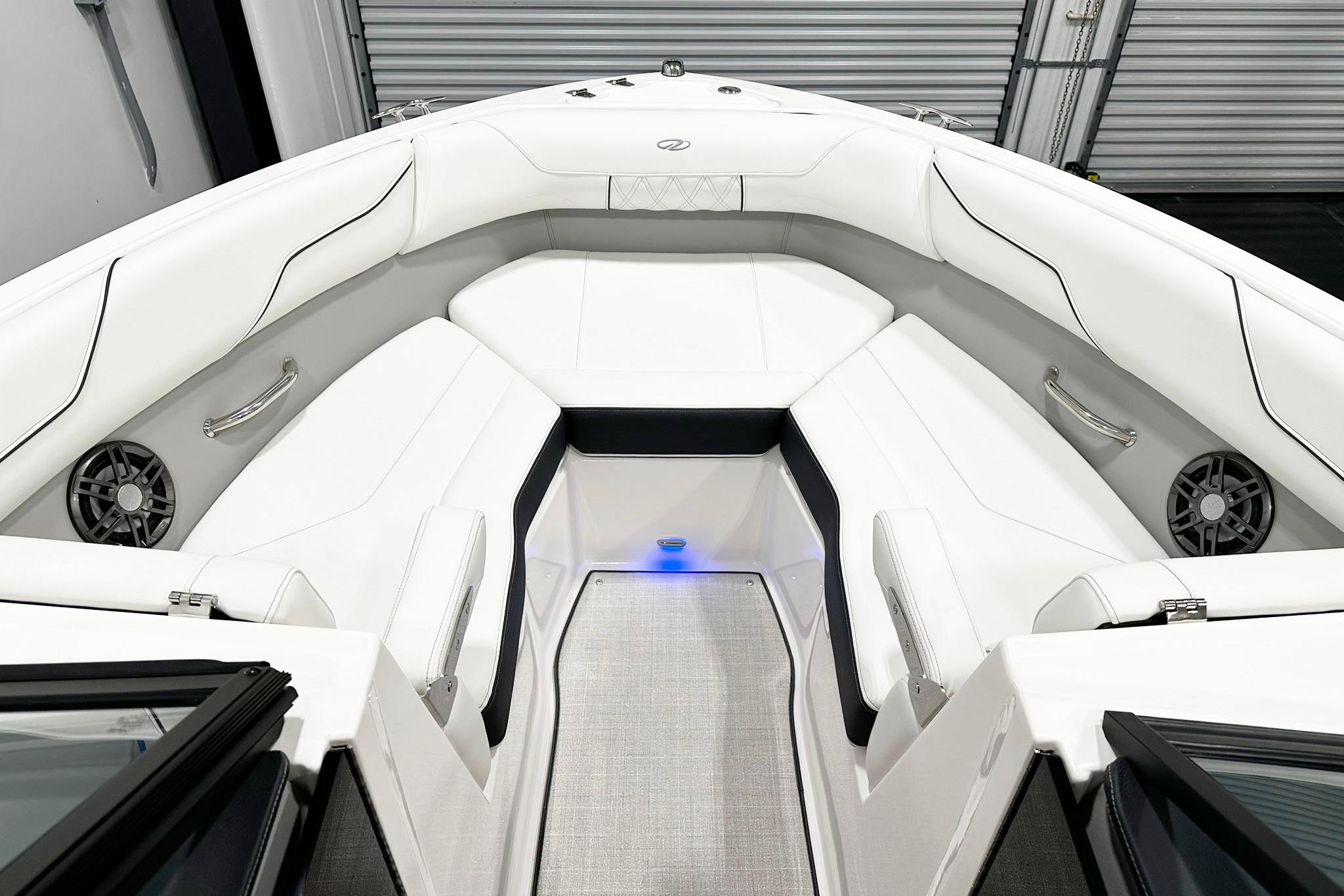 Luxurious interior of 2025 Regal LS2 boat with white seating and modern design.