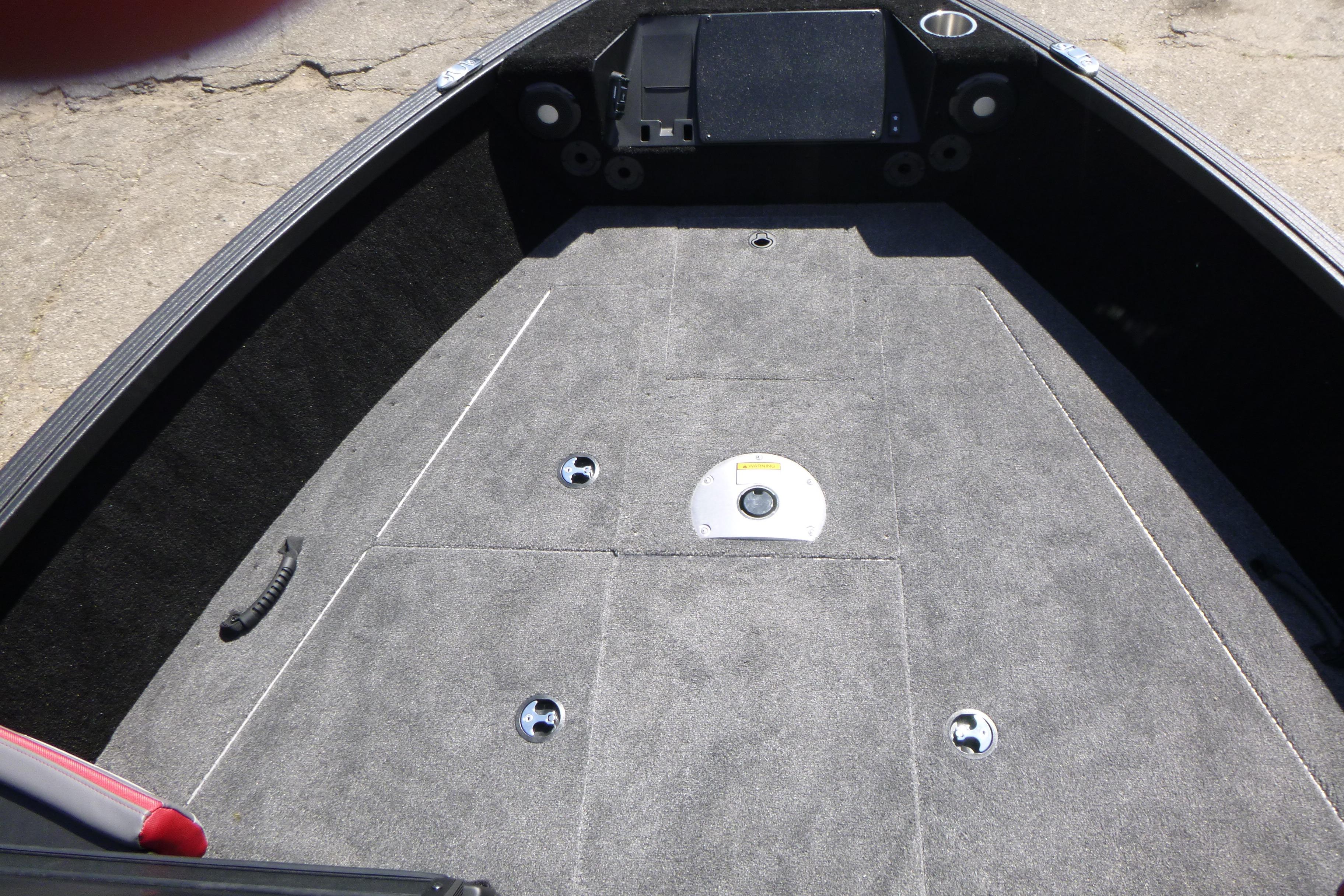 2025 Alumacraft Trophy 185X Sport boat interior with carpeted deck and storage compartments.
