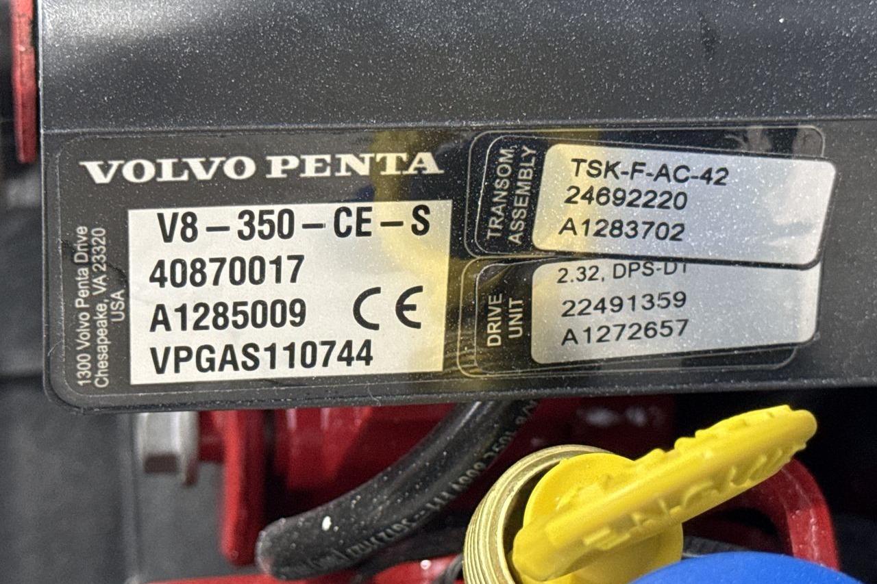 Close-up of a Volvo Penta V8 engine with technical details on a label.