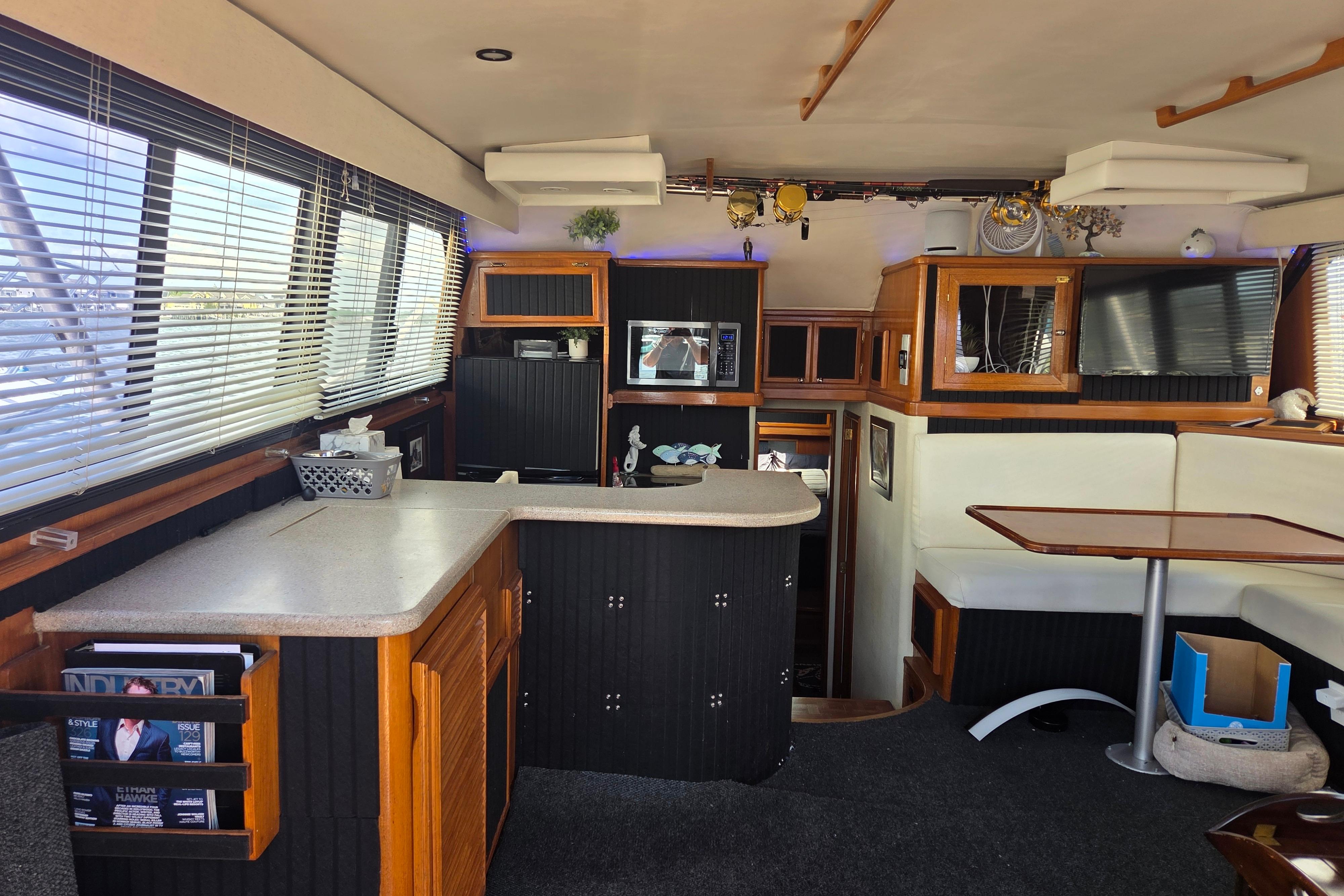 Interior of 1990 Egg Harbor Golden Egg 42 yacht with modern kitchen and seating area.