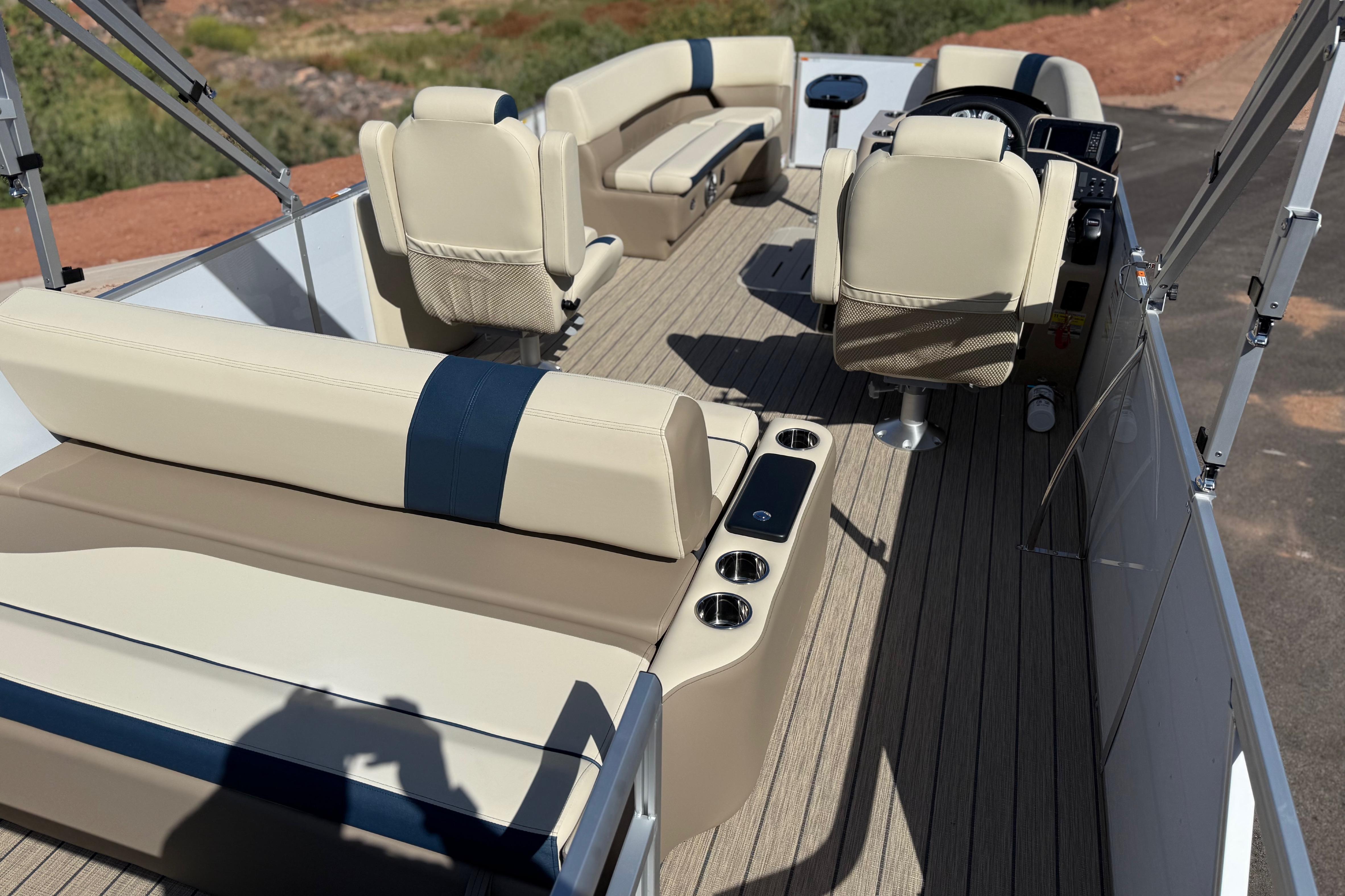 Interior of 2026 SunCatcher Select 322SL pontoon boat with beige seating and cup holders.
