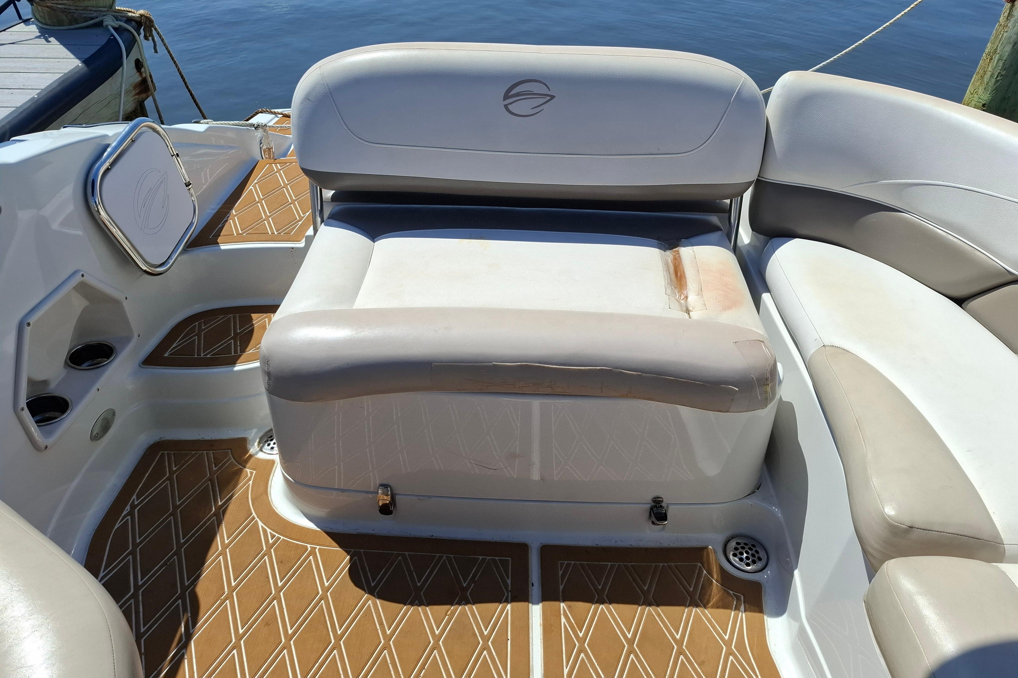 2013 Crownline Eclipse E6 boat interior with cushioned seating and patterned flooring.