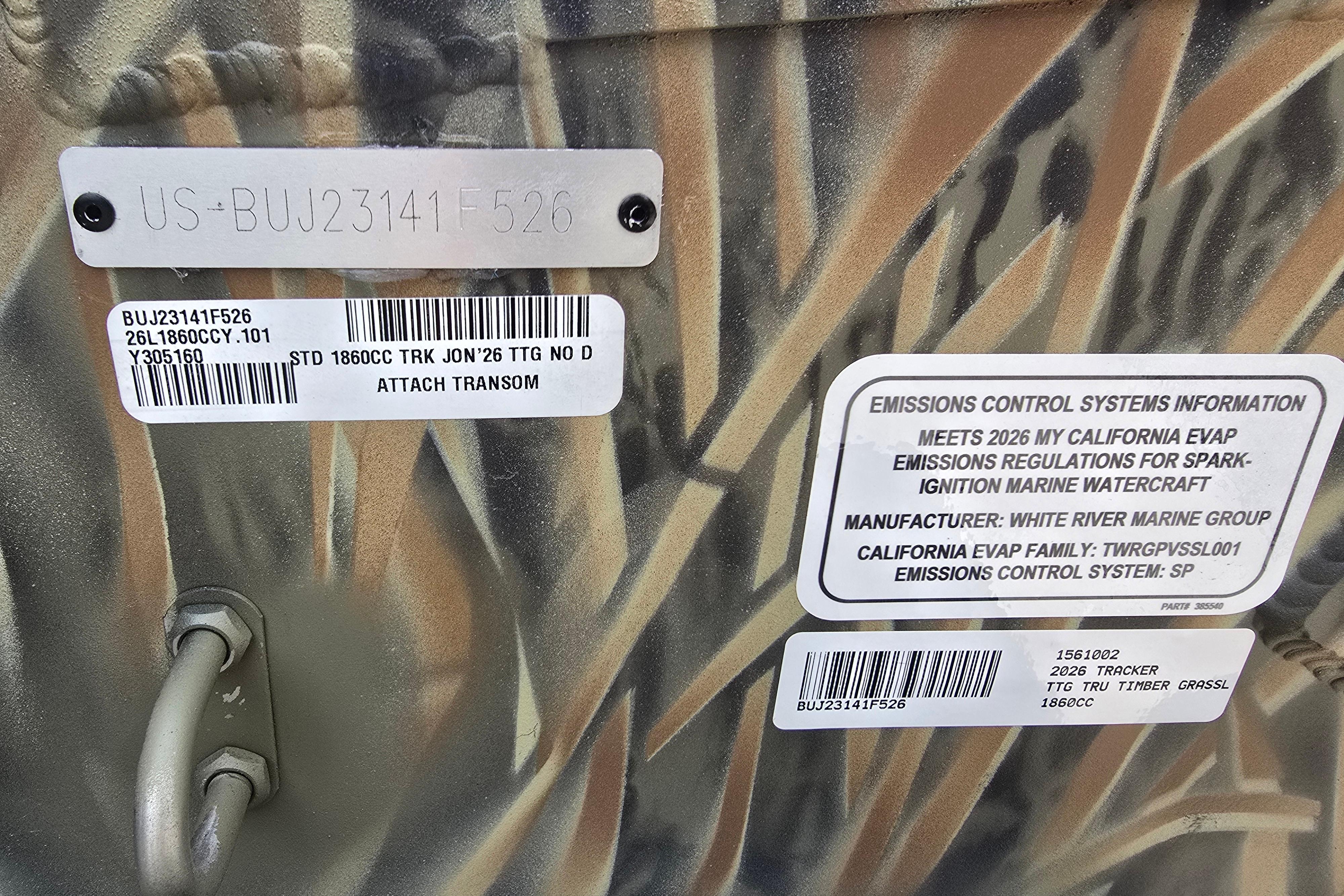 2026 Tracker Grizzly 1860 CC boat with emissions control information and identification labels.