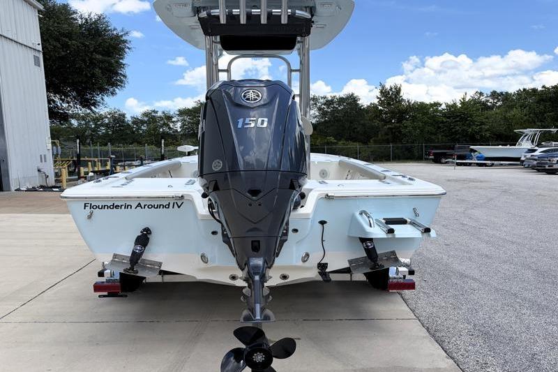 2025 Key West 210 Bay Reef boat with Yamaha 150 engine, parked outdoors.
