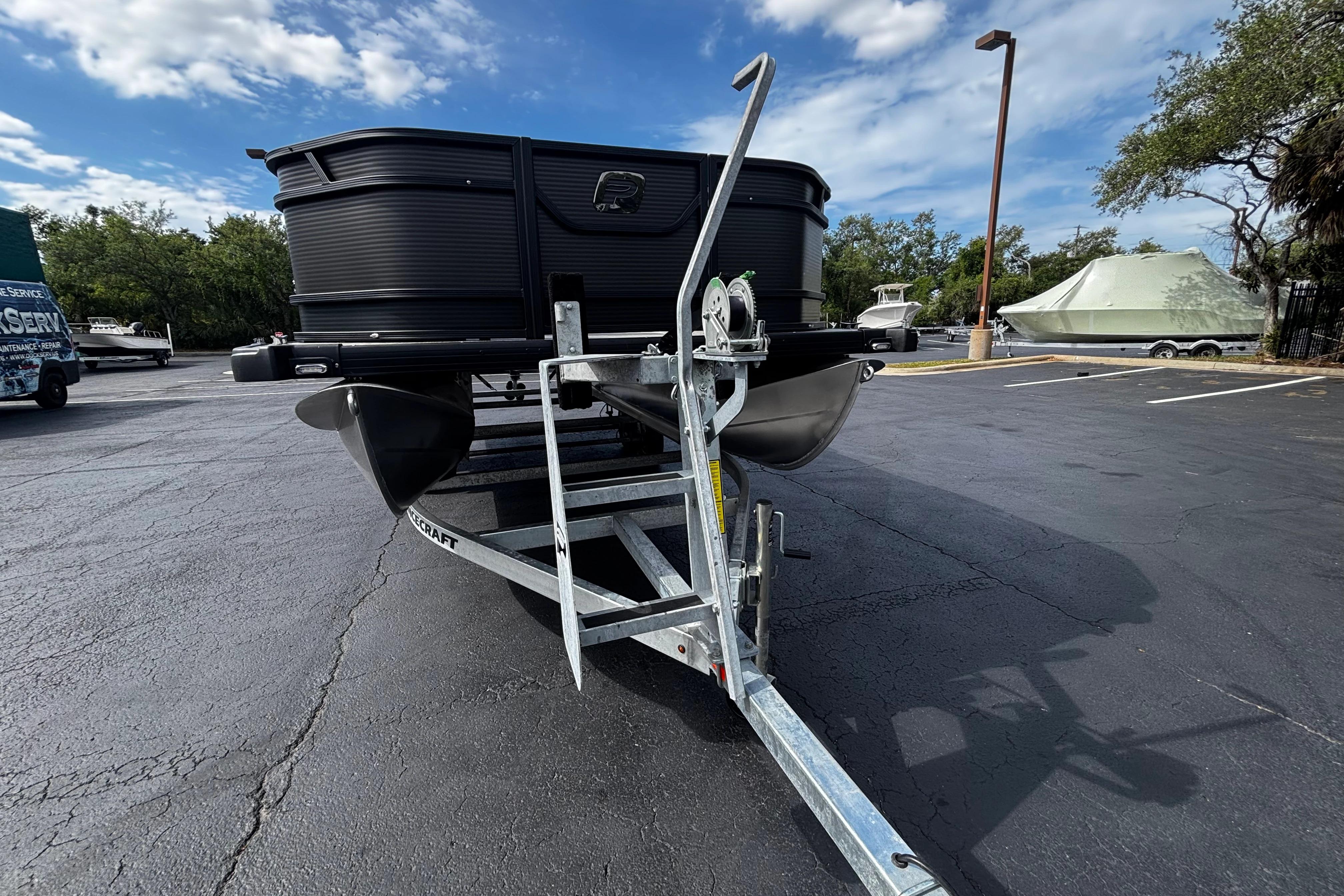 2026 Princecraft Sportfisher 21-2S boat on trailer in parking lot.