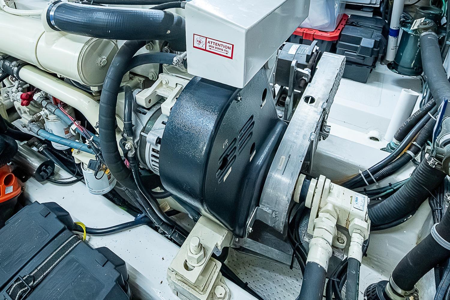 Engine room of 2003 Magna Marine Nova Scotia 47, showcasing mechanical components and wiring.