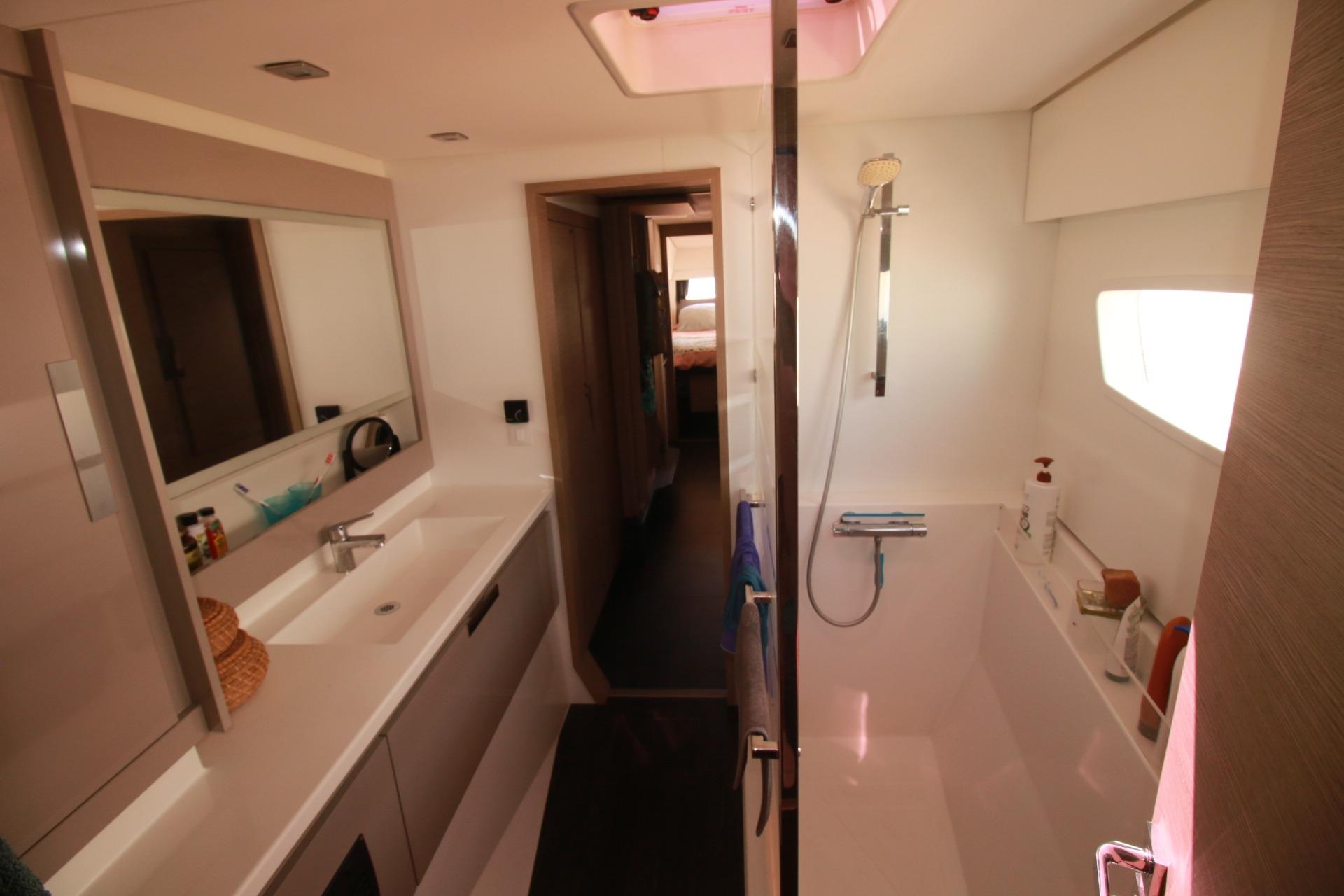 Interior of 2022 Fountaine Pajot Elba 45 Catamaran bathroom with modern fixtures.