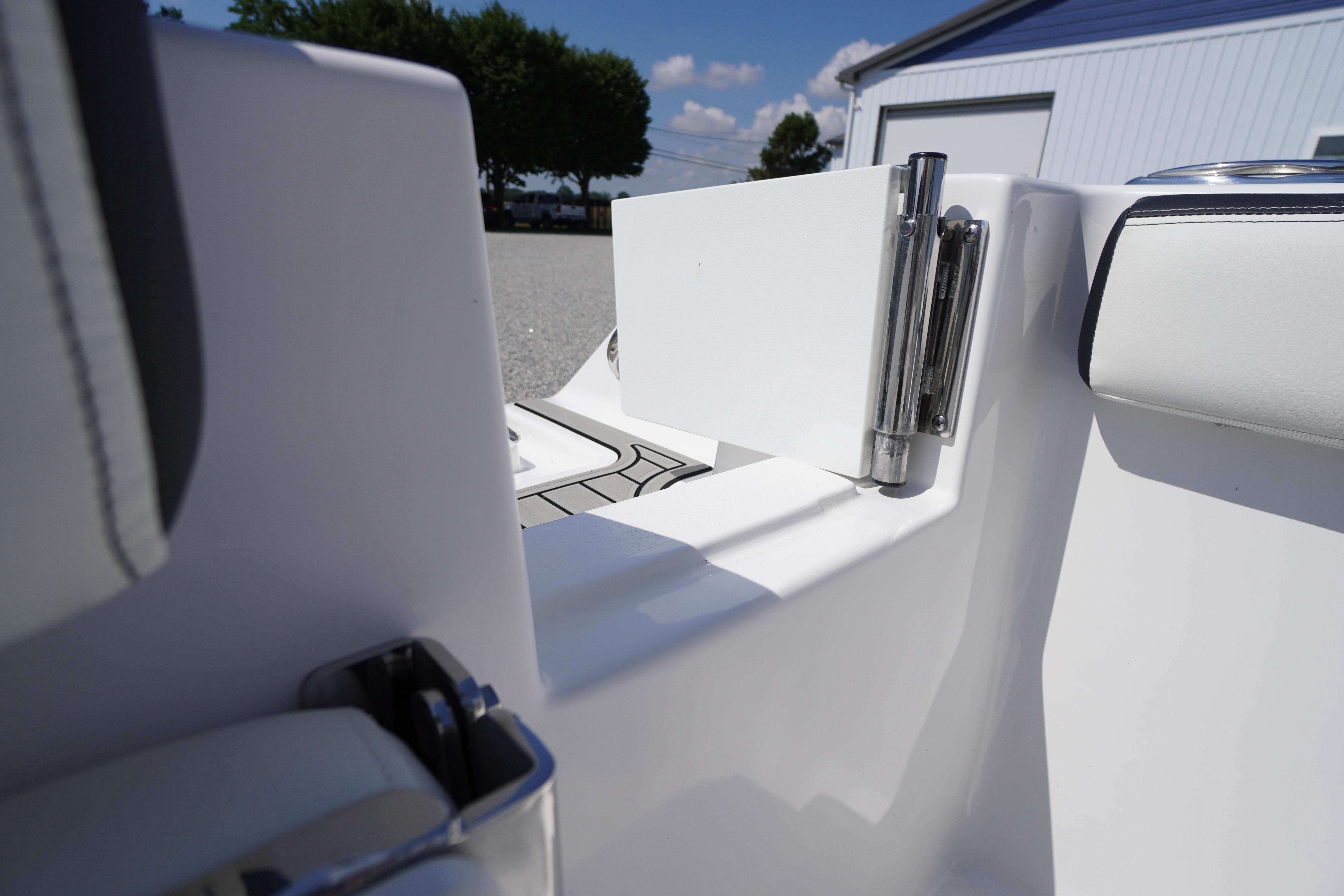 2026 Tidewater 220 CC Adventure boat interior detail with stainless steel hinge and seating.